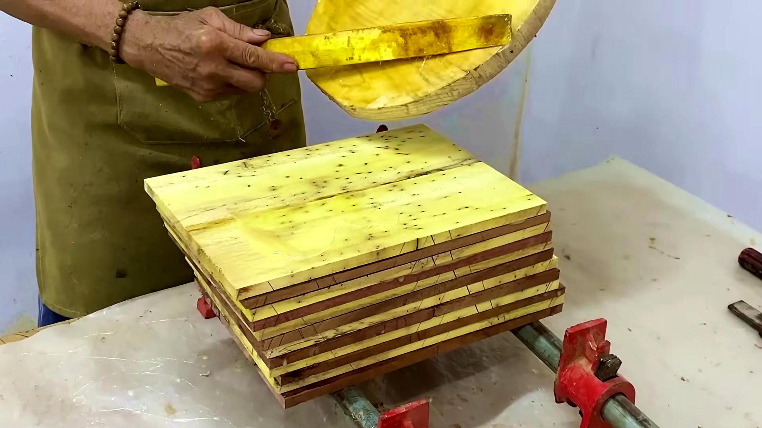 carpenter wooden shape forming process - wood parts being laid out or marked before the unusual shape is cut