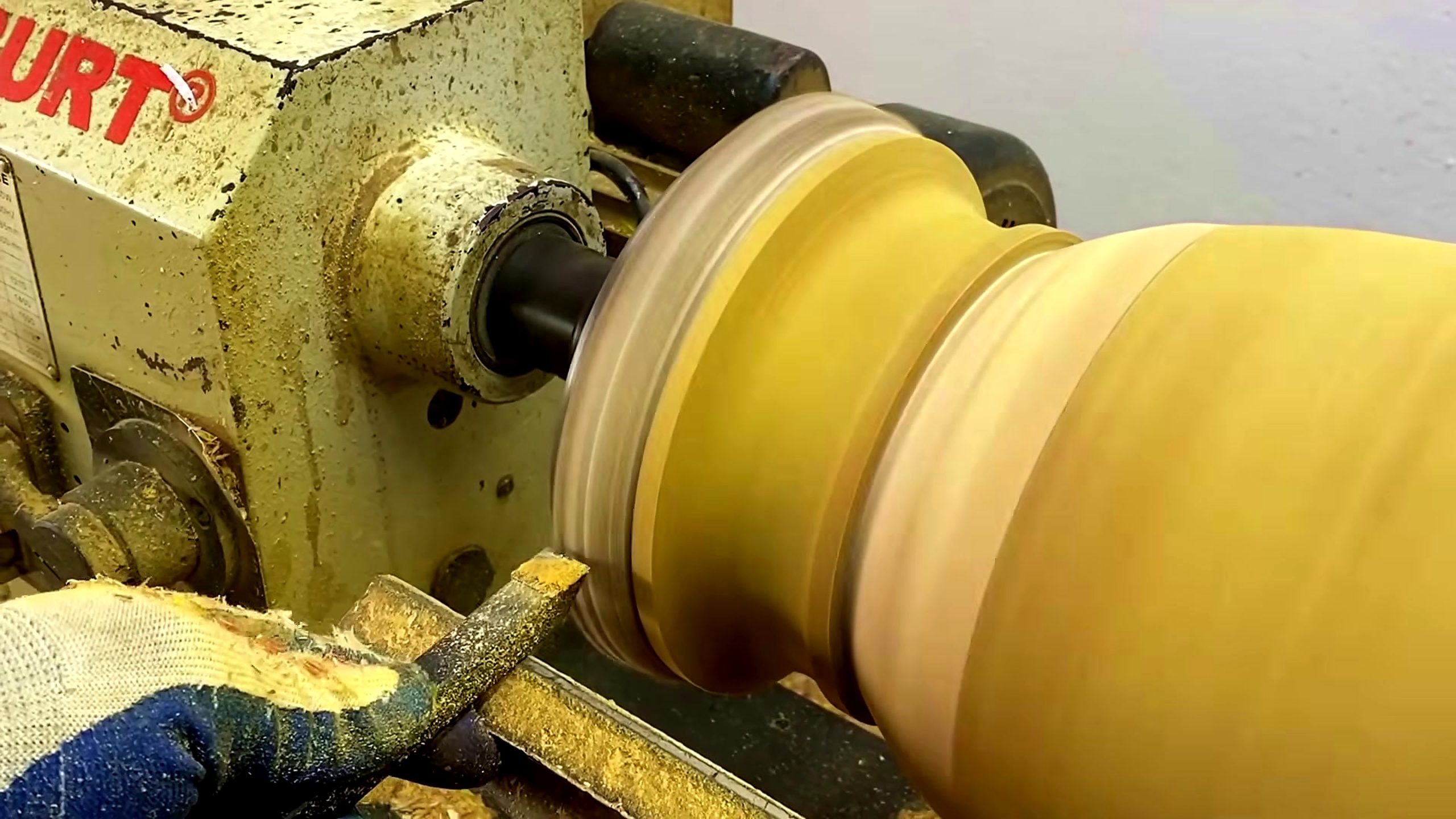 chainsaw log segmented wood bowl process - a turning tool working near the inside of the bowl form during rim review