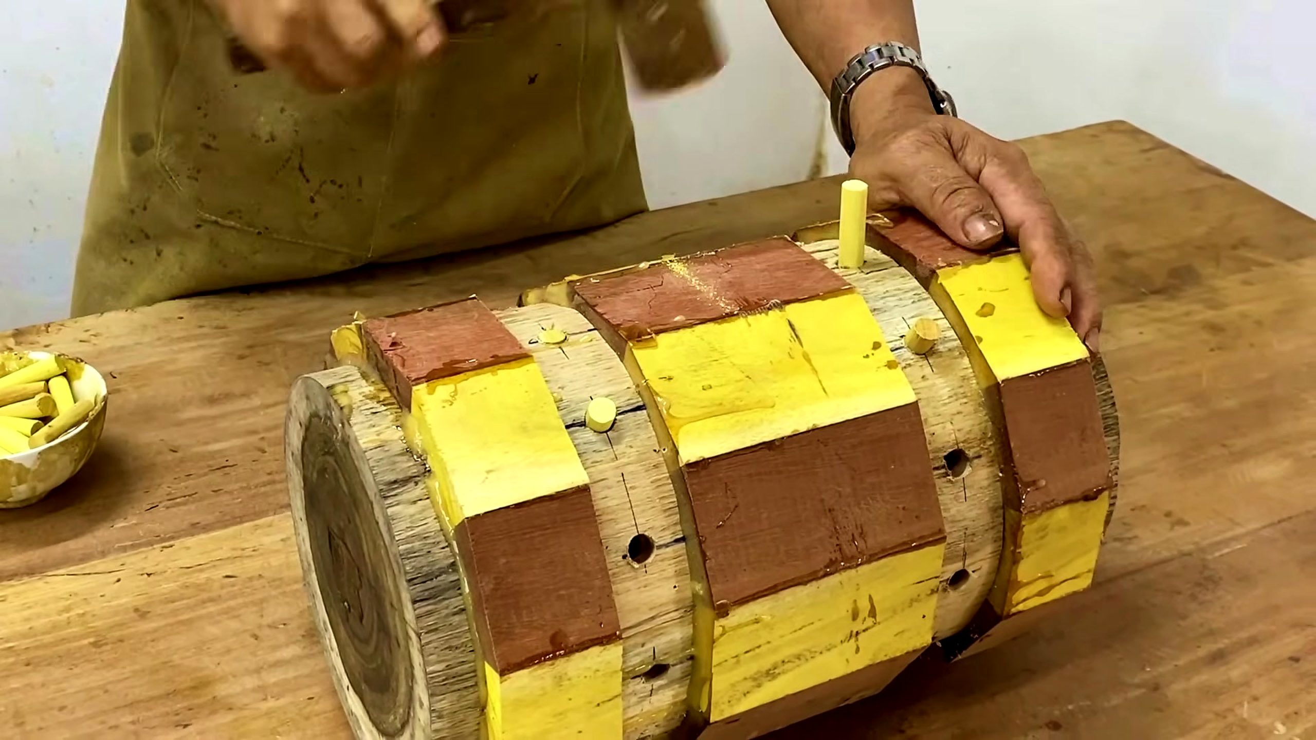 chainsaw log segmented wood bowl process - yellow and brown wood sections held together as a segmented blank