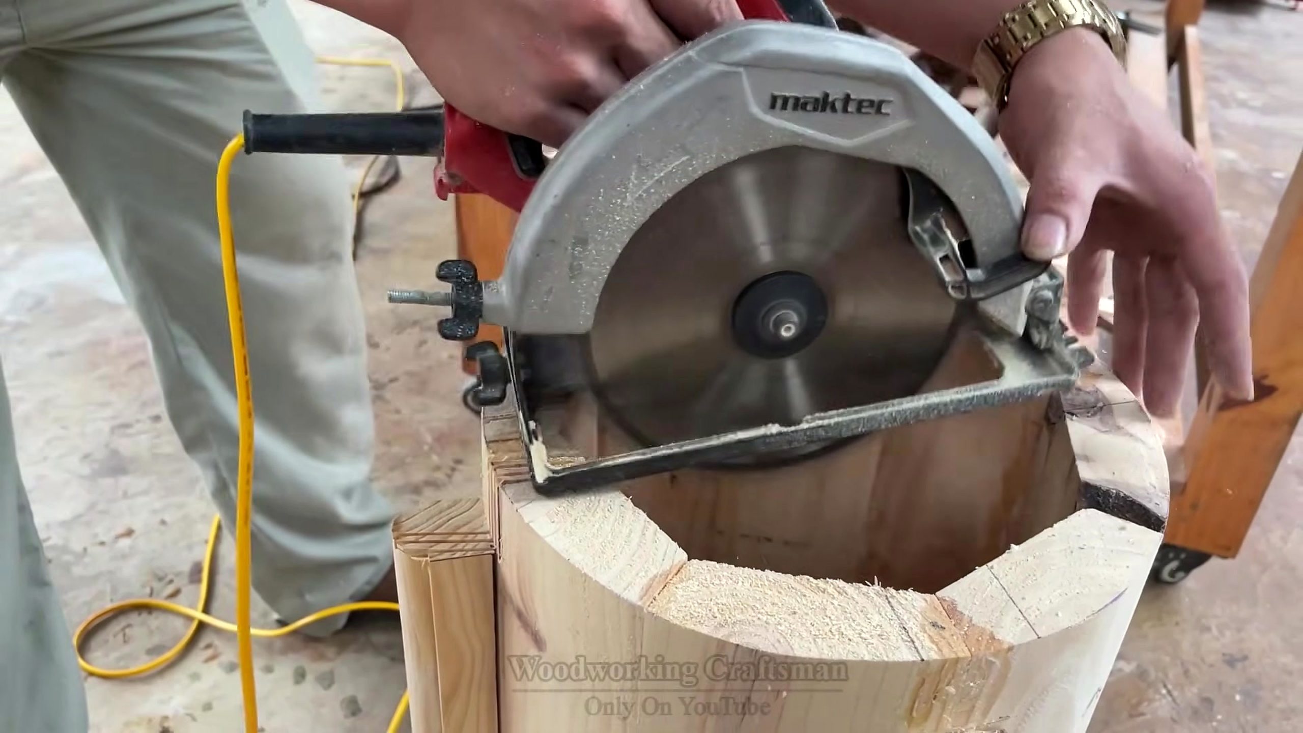 circular wood pedestal lattice furniture workflow - a handheld circular saw crossing a curved wood segment near the round form