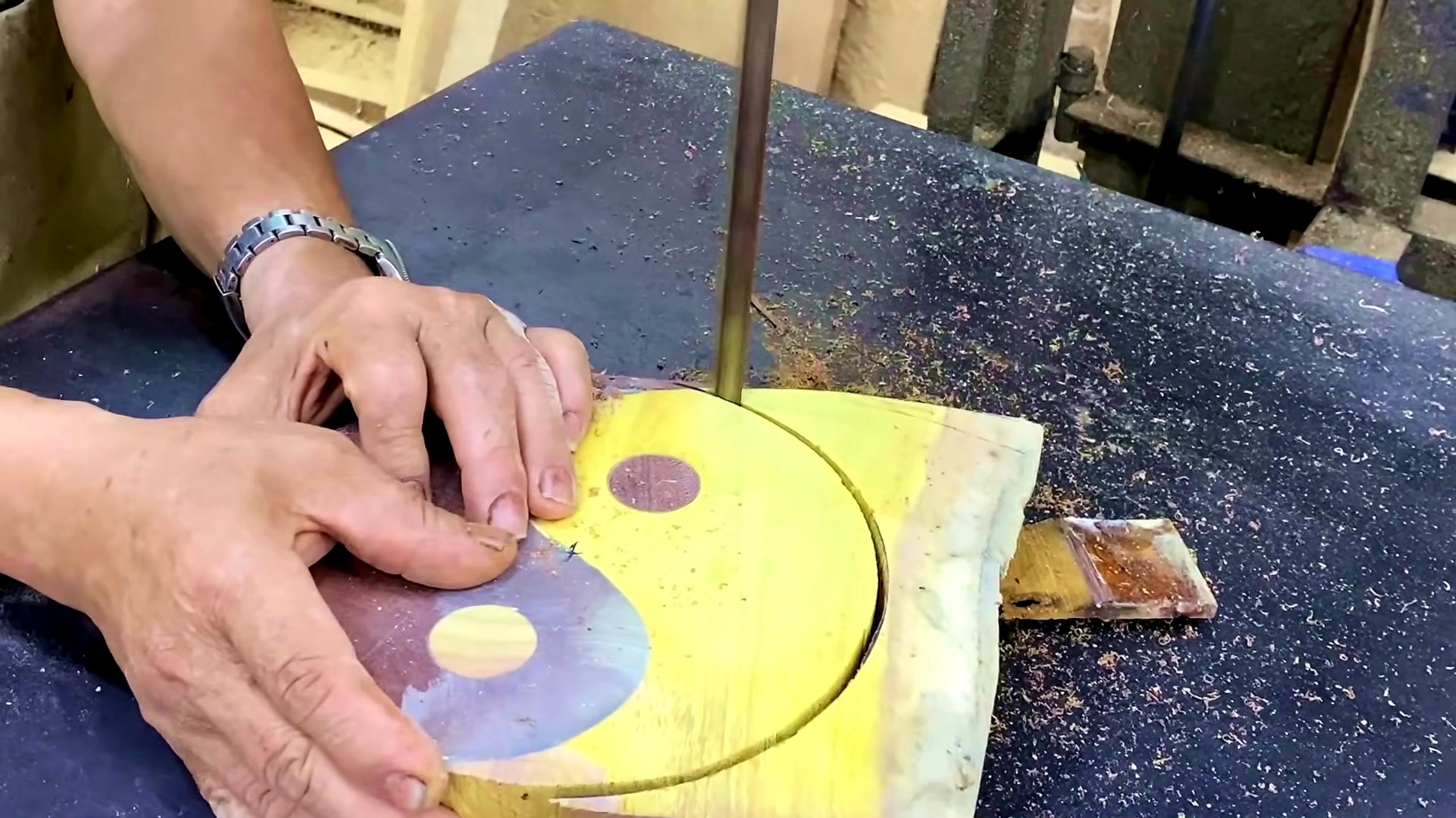 discover unbelievable ways work wood ideas - band saw cutting a circular yellow wooden blank