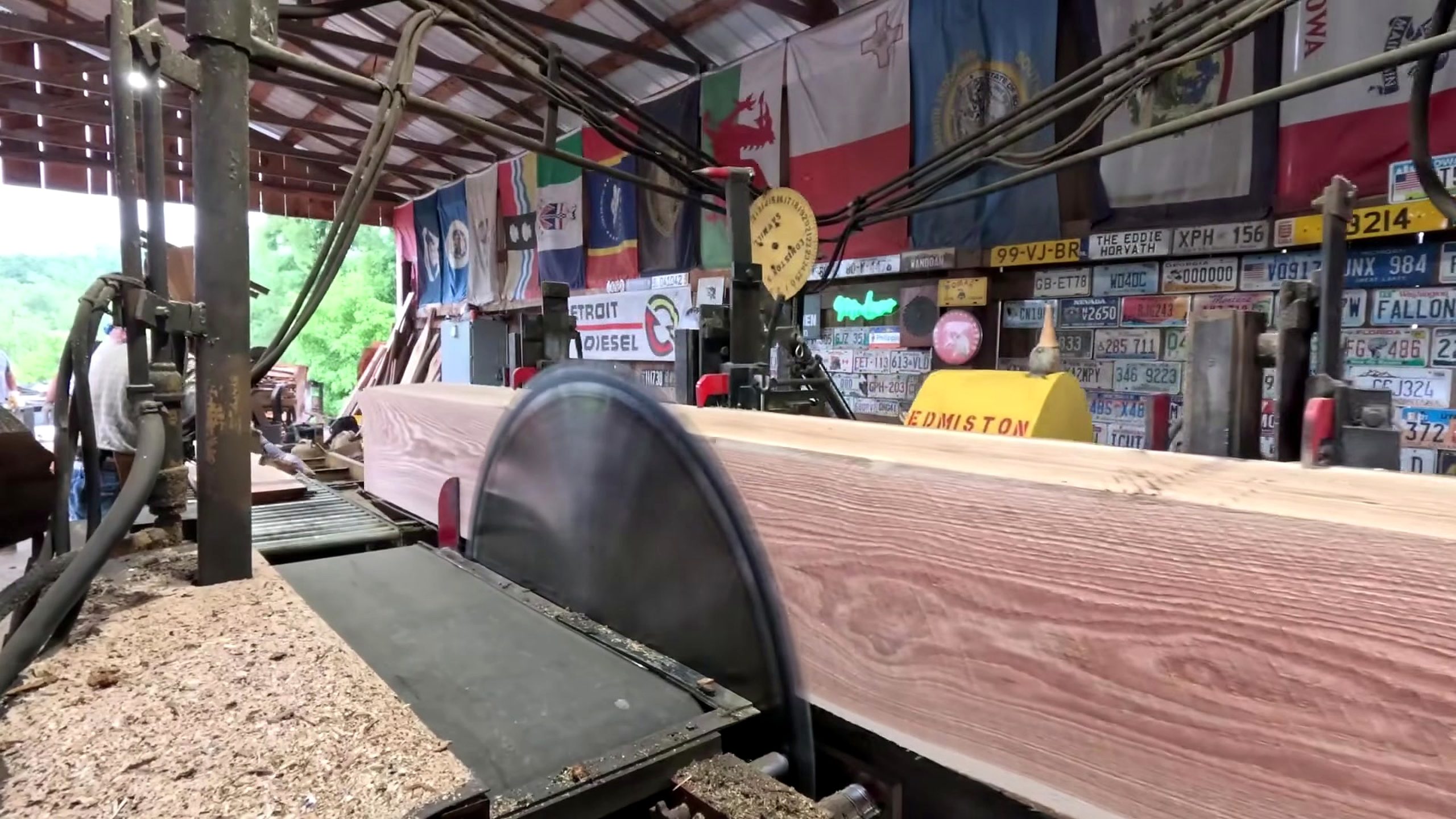 happy 4th july sawing big red log - a detail-check moment that helps readers inspect the process