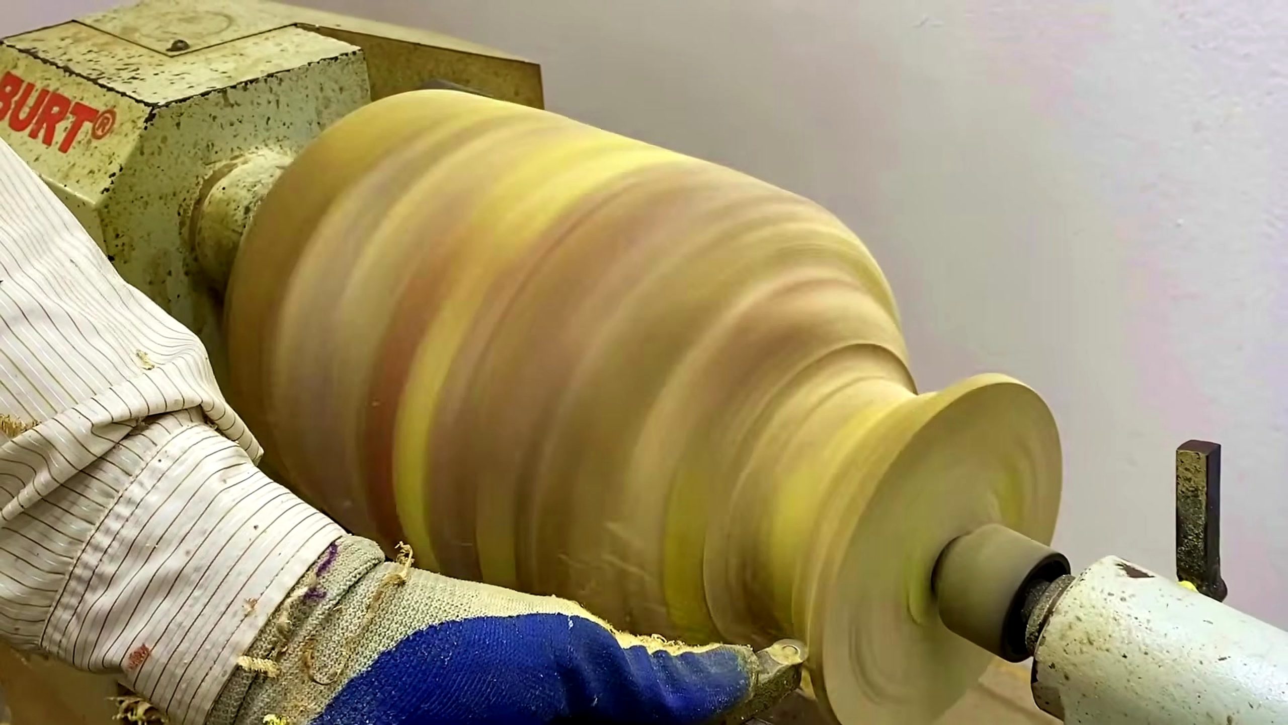 patchwork wood vase turning process shaping the rounded vase body on a lathe