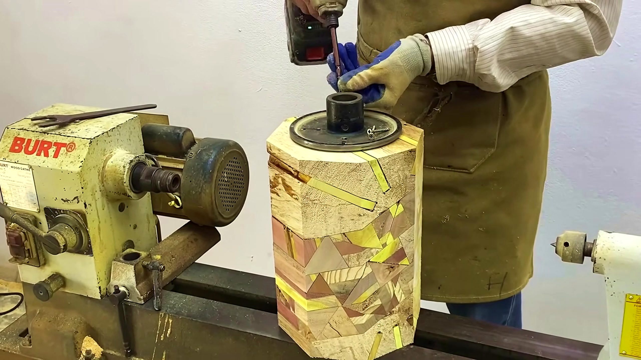 patchwork wood vase turning process with the patterned blank mounted at the lathe