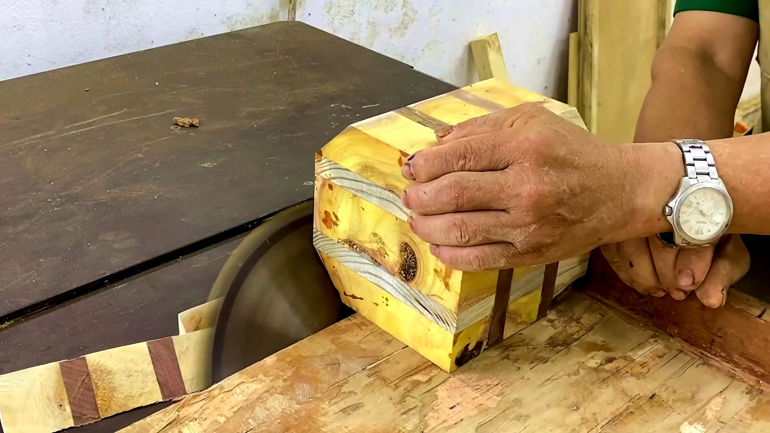 laminated wood bowl turning process - the laminated blank being trimmed and controlled at the table saw