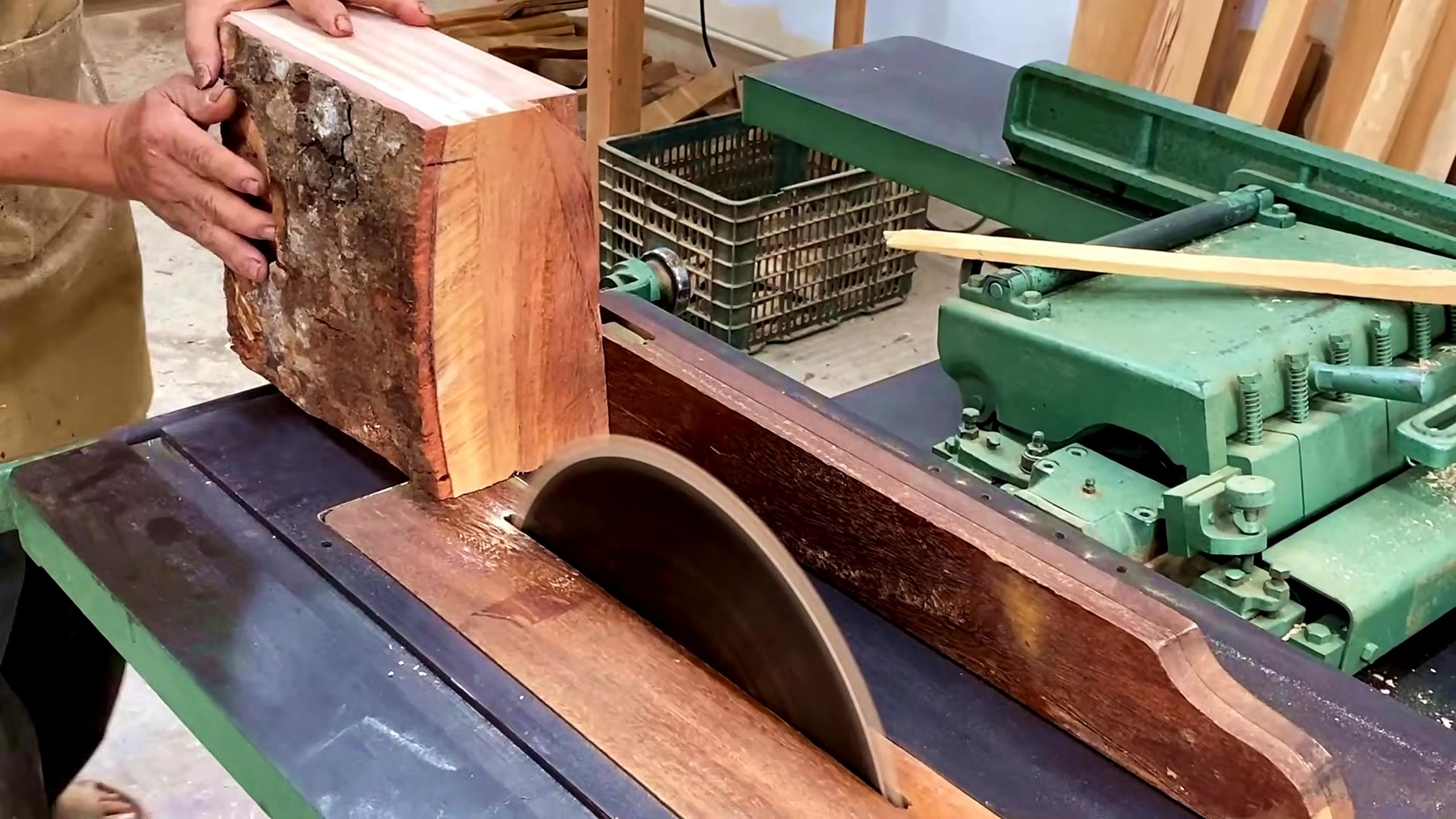 let make pieces wood valuable ways - bark edged wood block held near a table saw during the first preparation stage