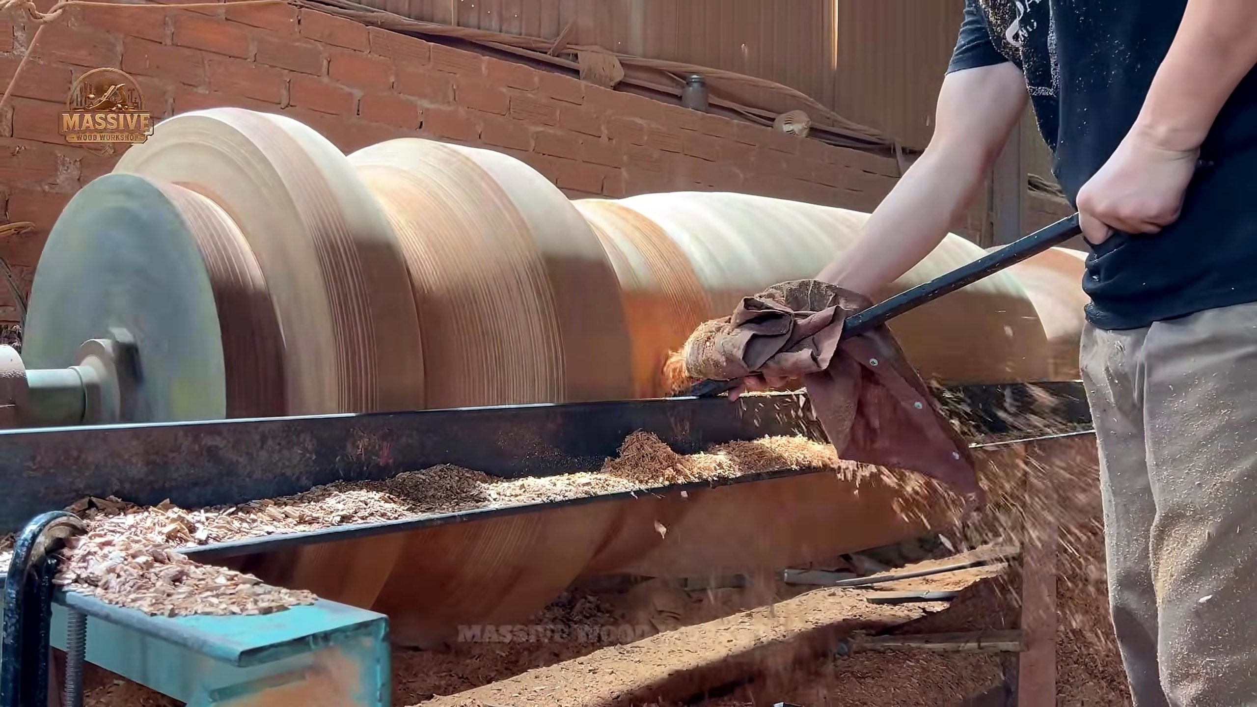 massive log transformation art - cutting work that starts separating mass from usable material
