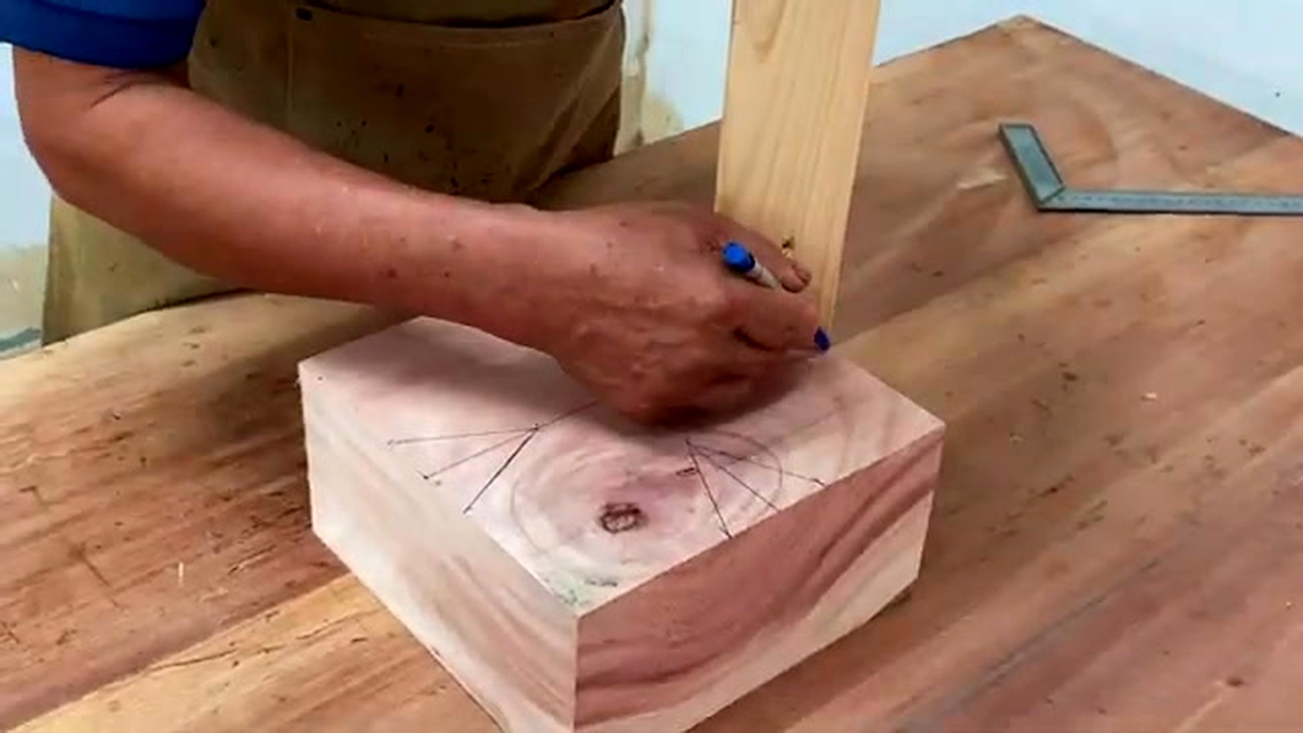 patterned wood lathe bowl process - circle and segment layout lines drawn on a pale wood blank before machine work