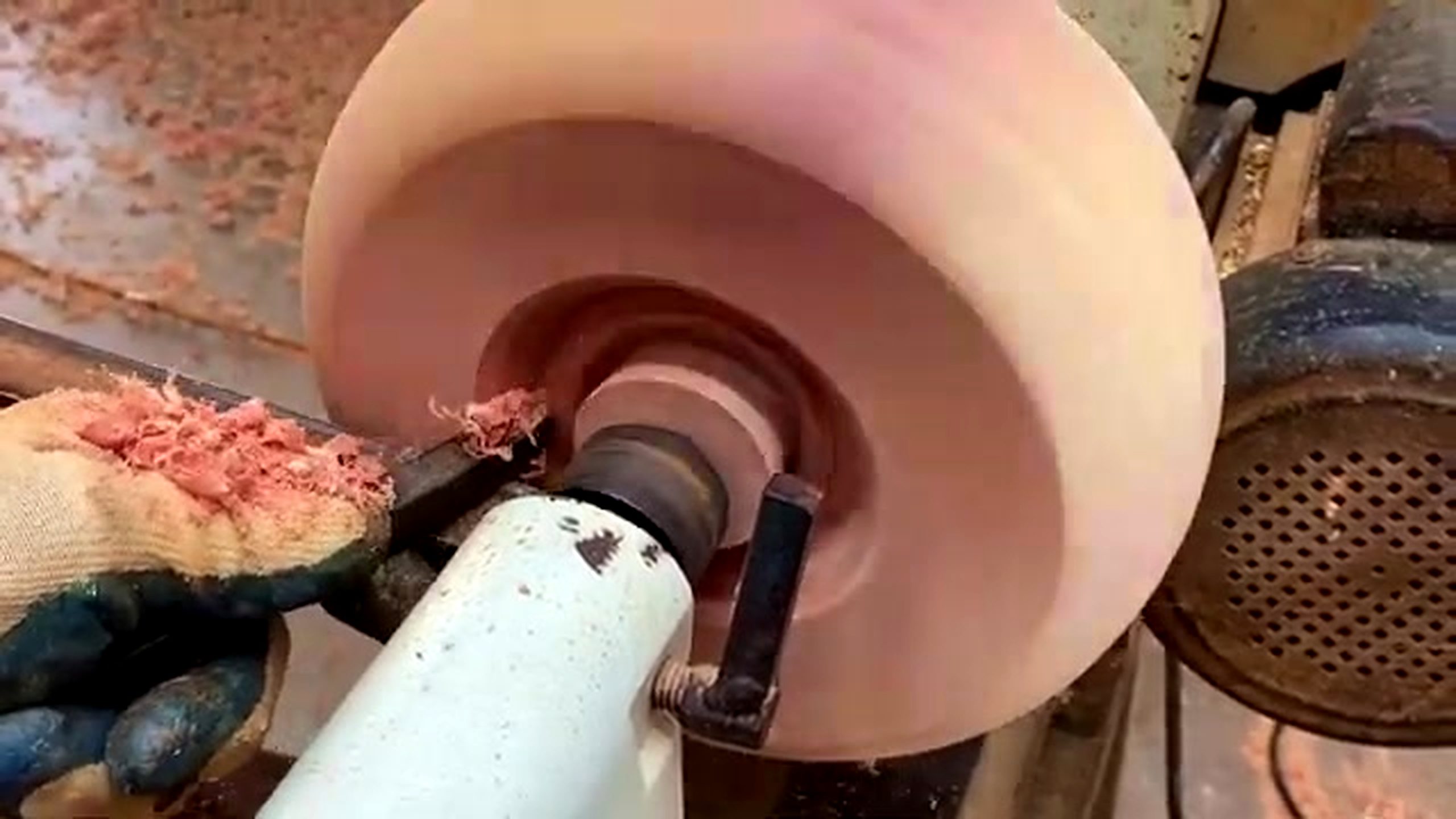 patterned wood lathe bowl process - the patterned blank spinning on the wood lathe during outside shaping