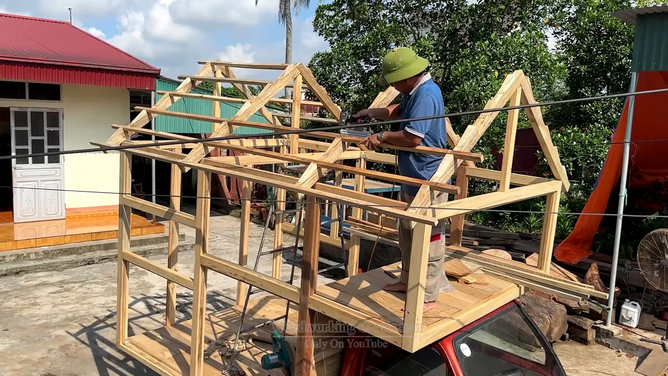 see guy did cherry wood logs roof frame taking shape on a small wooden house