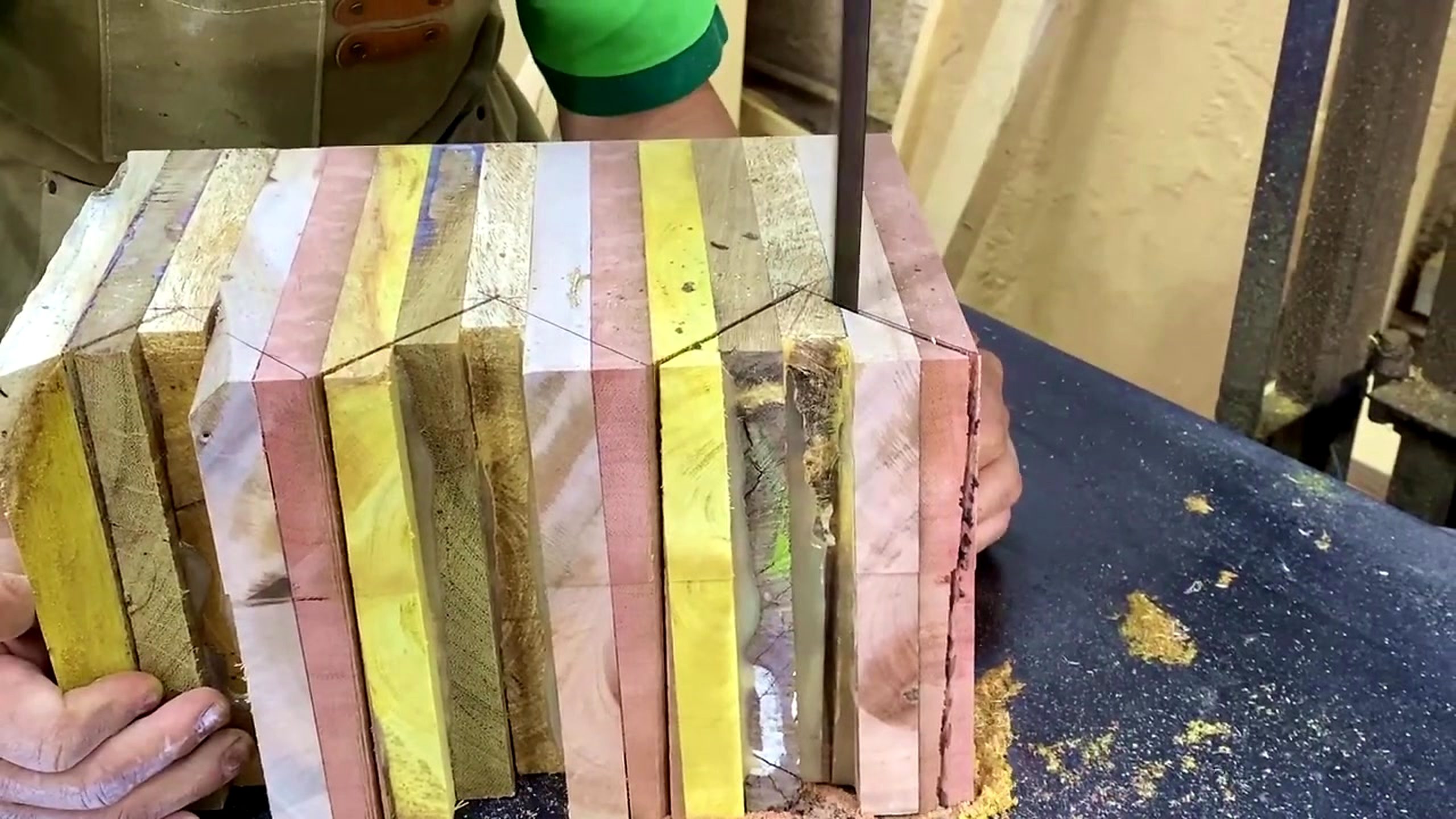 striped laminated wood lathe form process - the multi-color striped laminated blank held upright so the layer map can be inspected