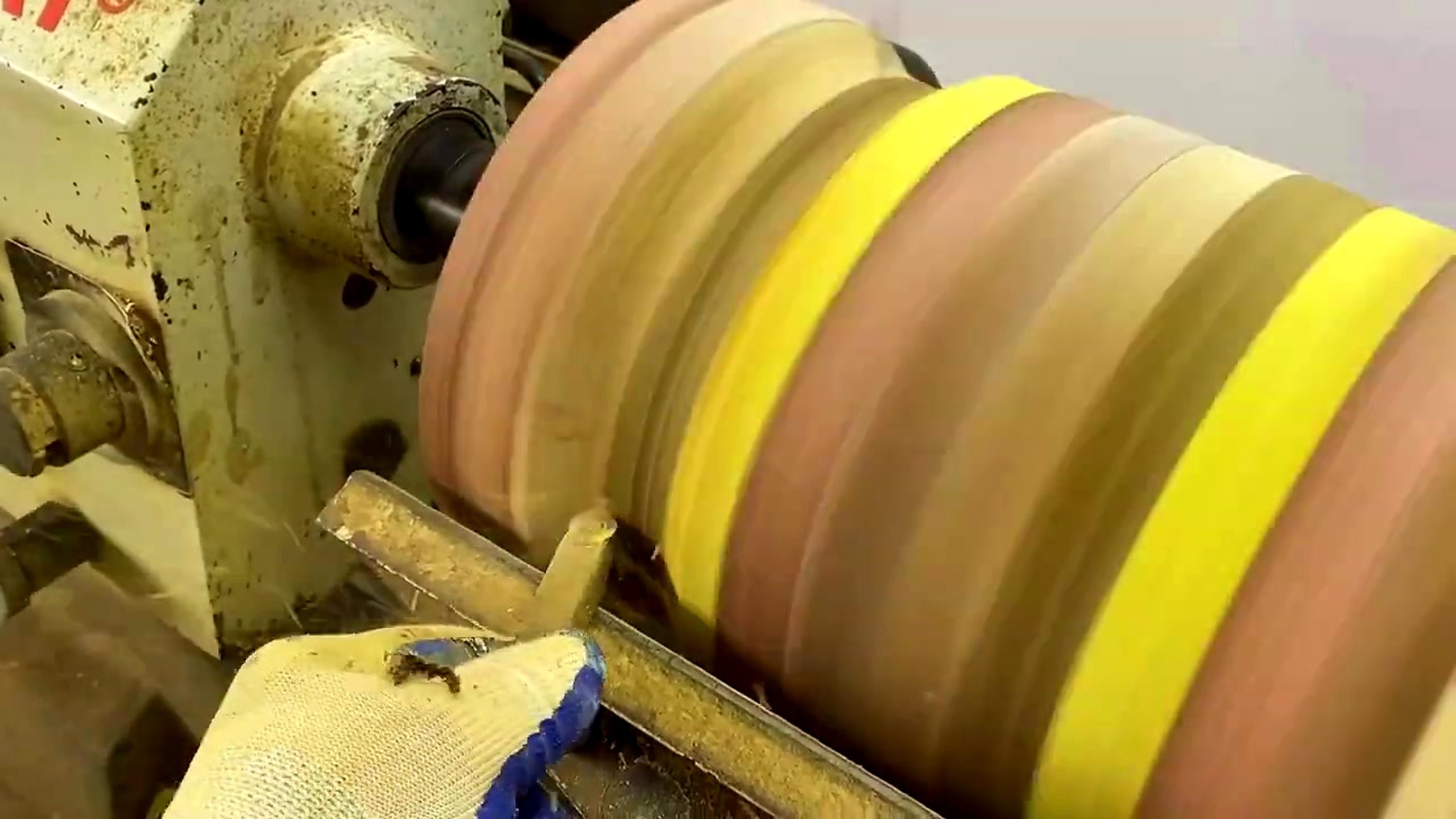 striped laminated wood lathe form process - the wider lathe form after rough turning exposes the continuous stripe pattern