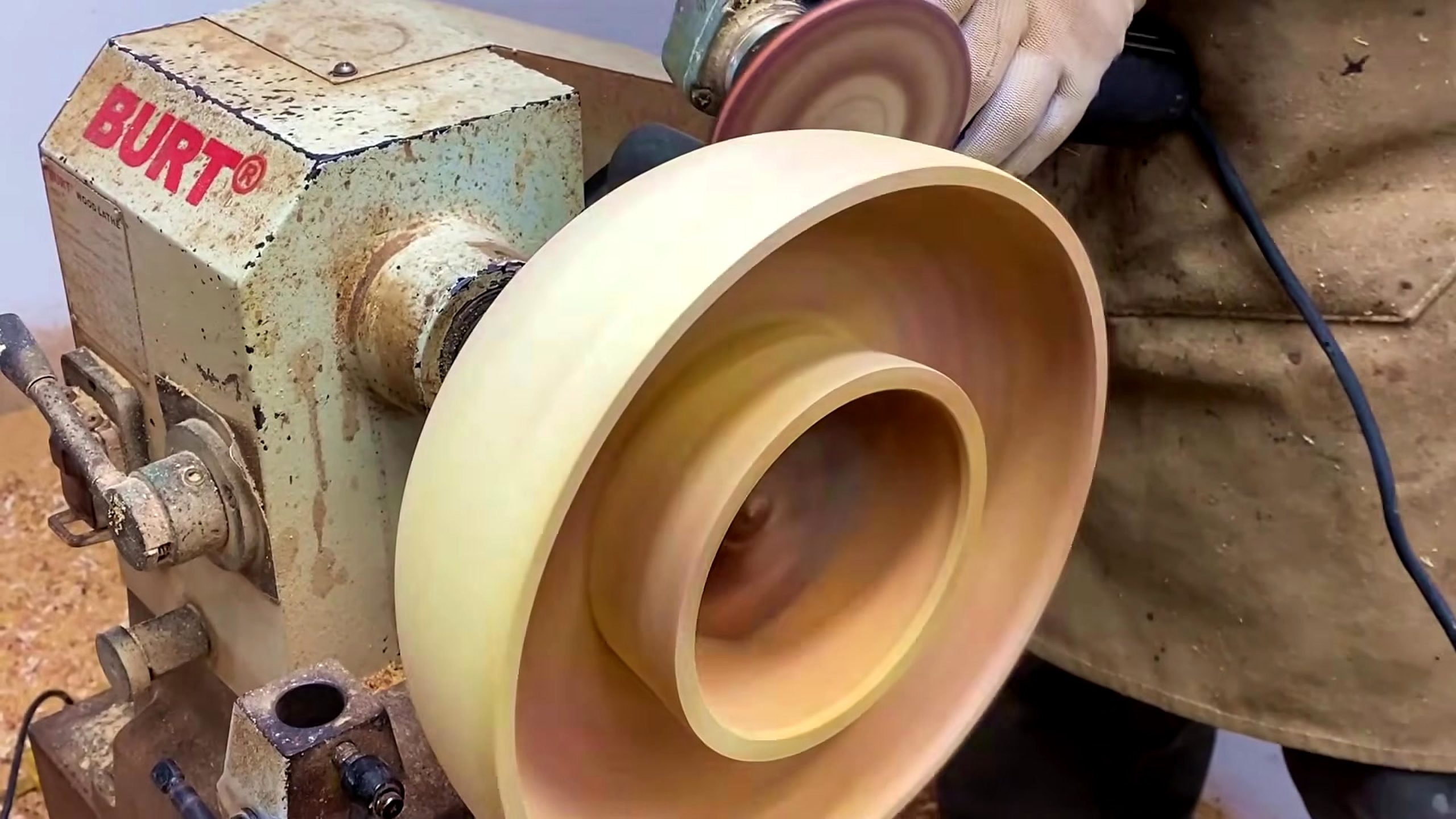 wood lathe segmented bowl process - the completed bowl profile and rim detail still mounted on the lathe