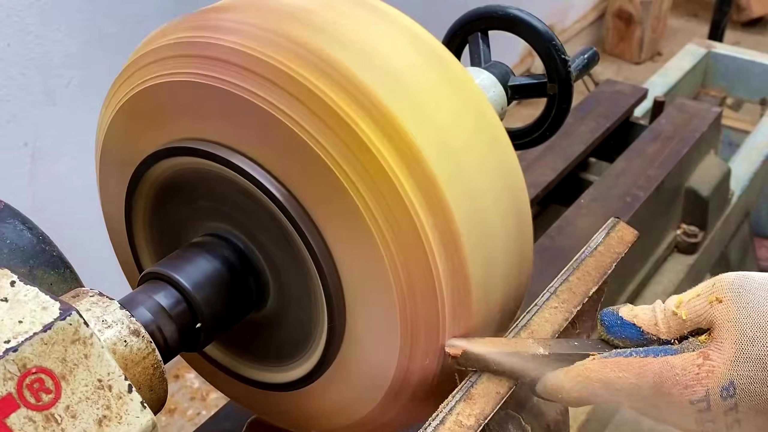wood lathe segmented bowl process - the segmented blank spinning on a wood lathe during outside shaping