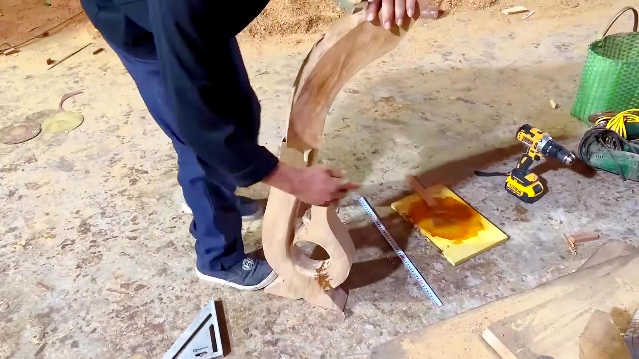 woodworker builds installs wooden stair railing - the later review stage where the result can be evaluated