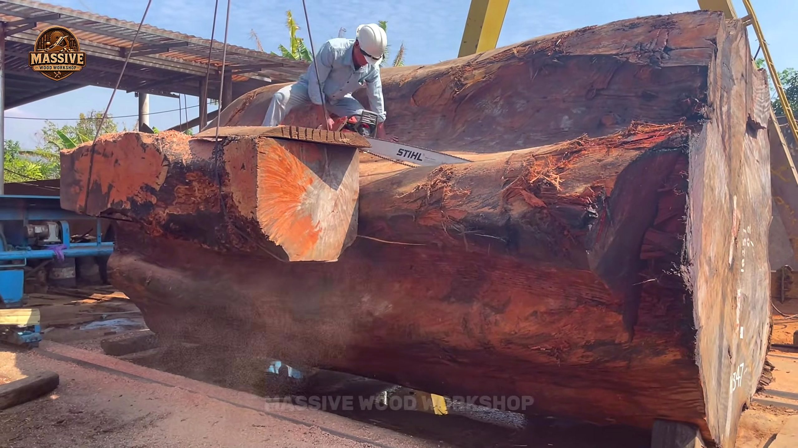 giant hardwood log bandsaw slab cutting upper-face work and clearance check