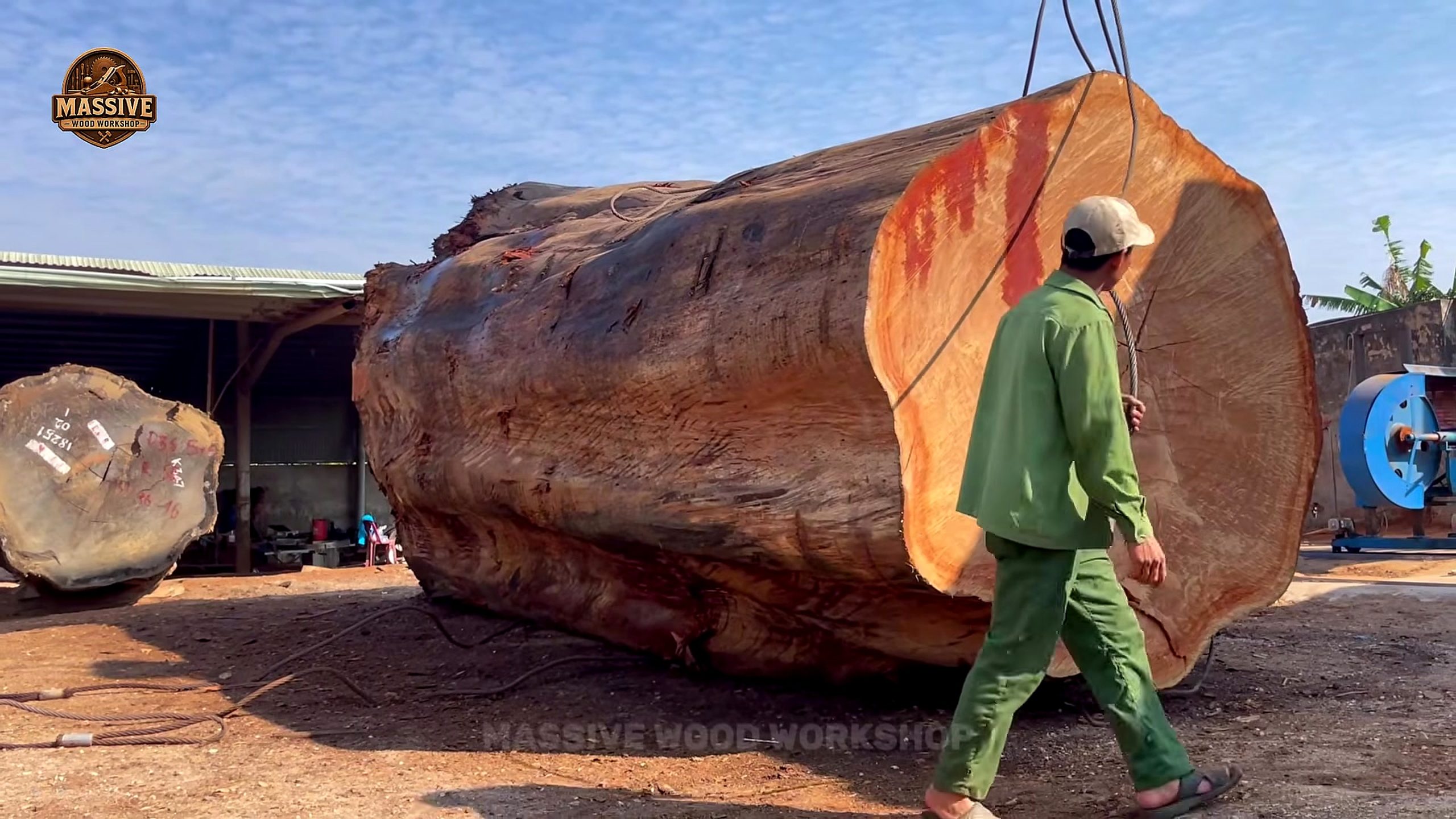 giant hardwood log bandsaw slab cutting end-face inspection before rigging