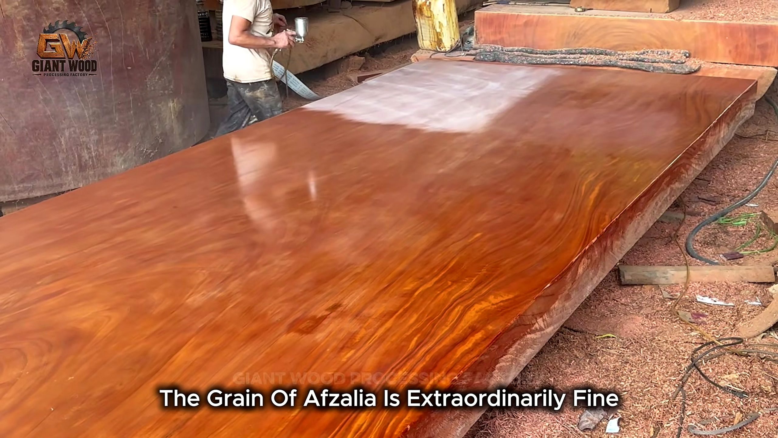 Handheld power planer flattening a wide slab and leaving parallel cutting tracks