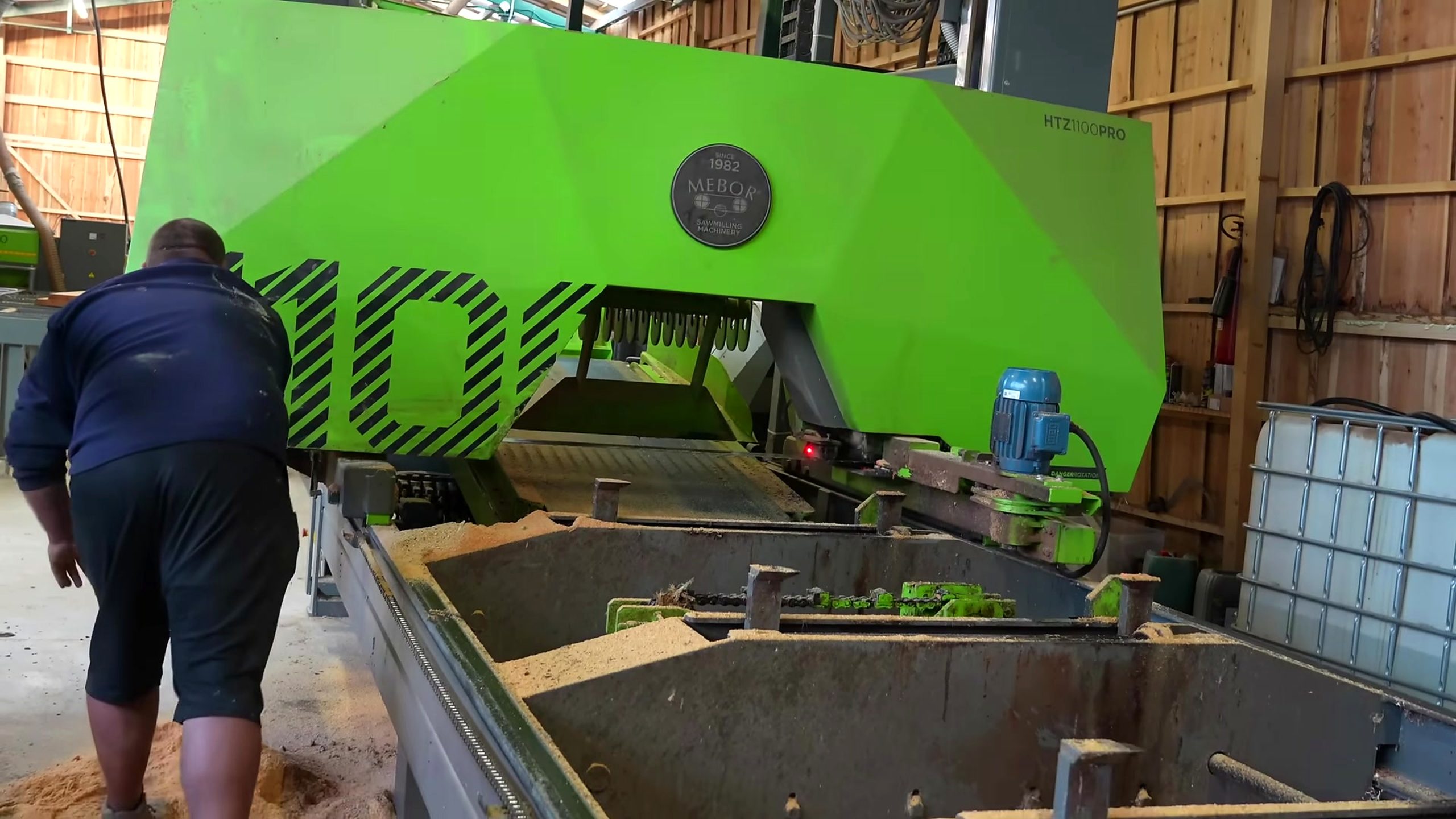cutting huge oak logs planks roof sawmill - the setup or early workflow visible in the source video