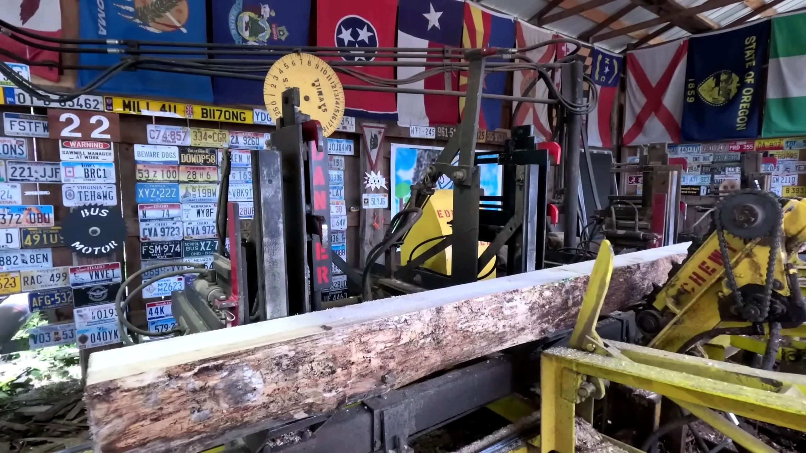 long squared timber aligned for repeatable sawmill passes into 2x8 shed floor boards