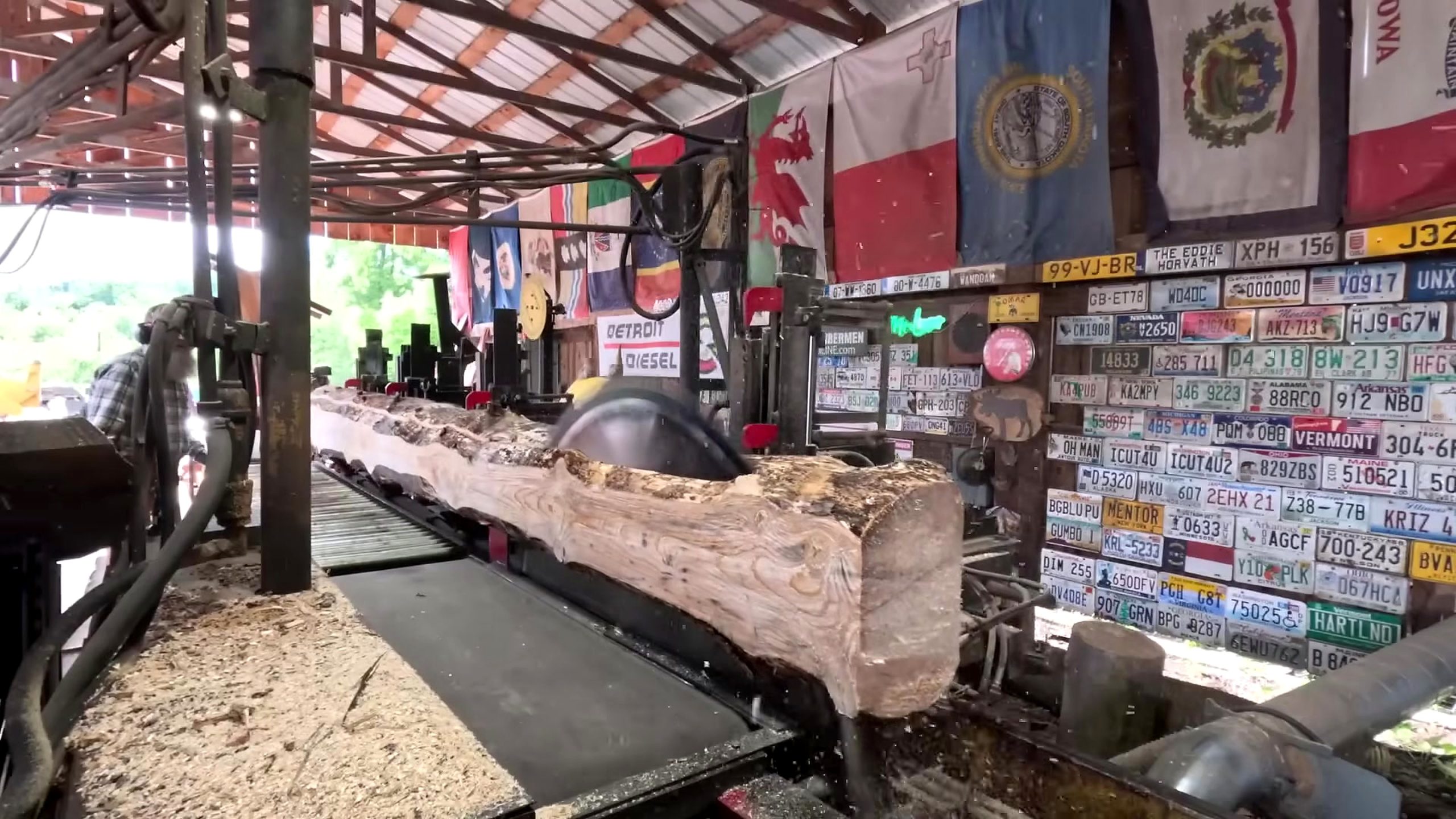 flat sawn face appearing while a log is converted into a cant for shed floor 2x8 boards