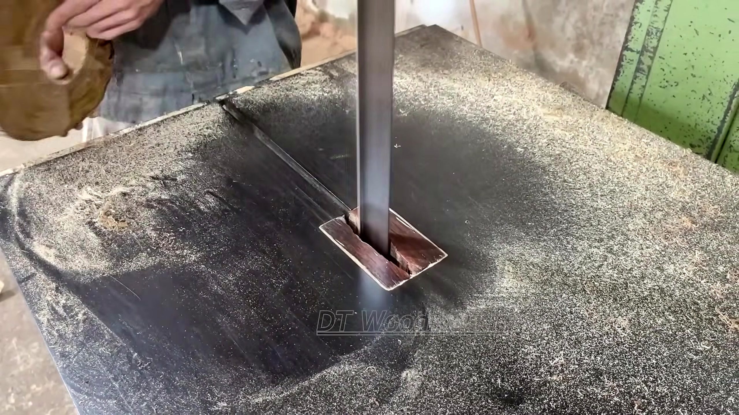 forgotten giant tree stump woodworking process - a narrow bandsaw cut separating a smaller usable piece from the prepared material