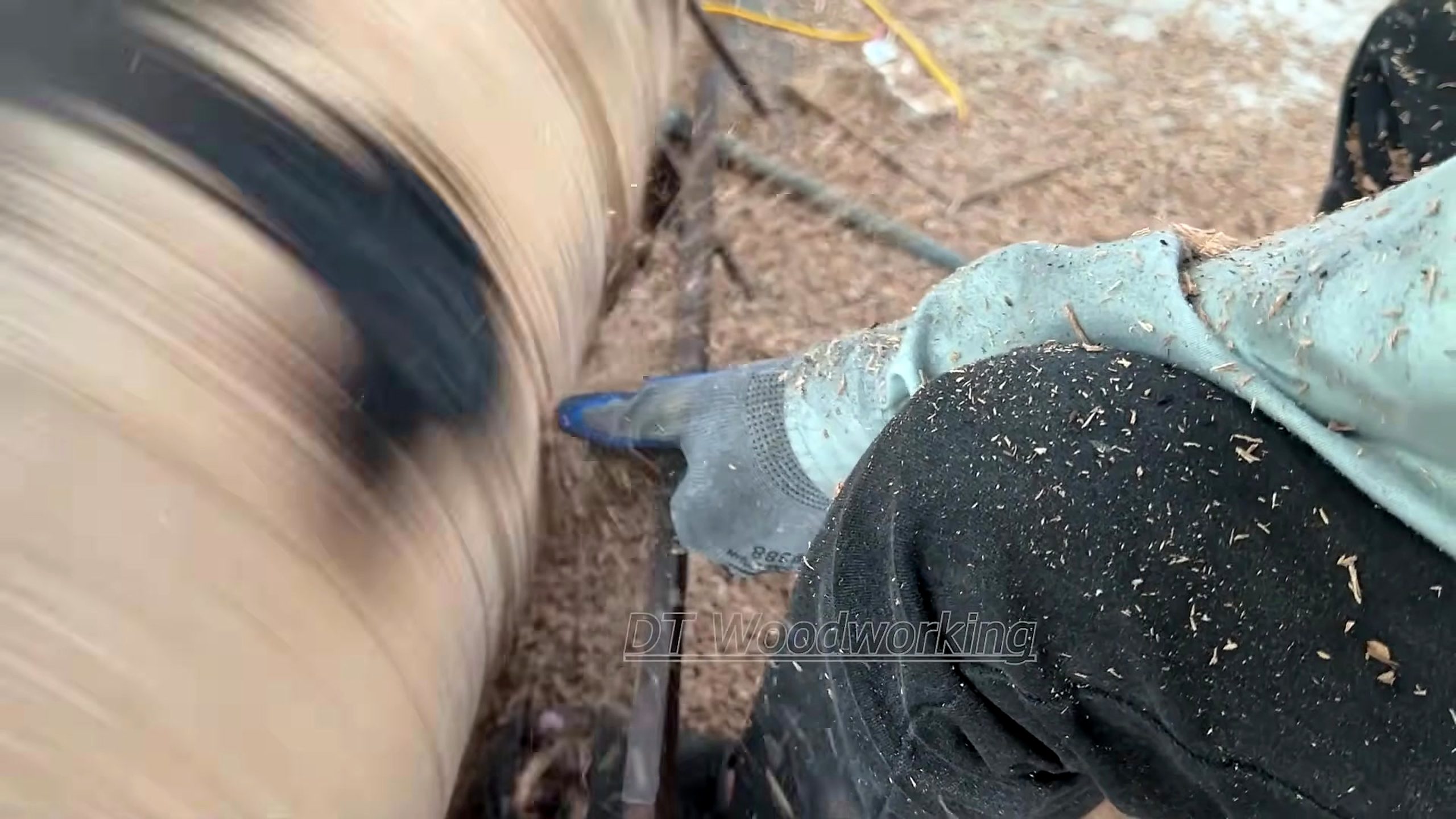 giant burnt log woodturning process - the rotating blank after irregular outer stock has been reduced