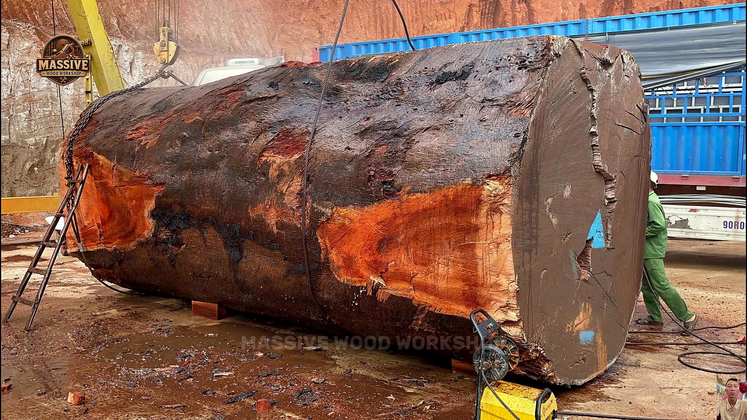 giant timber bandsaw round table process - the giant squared timber block staged before machine breakdown