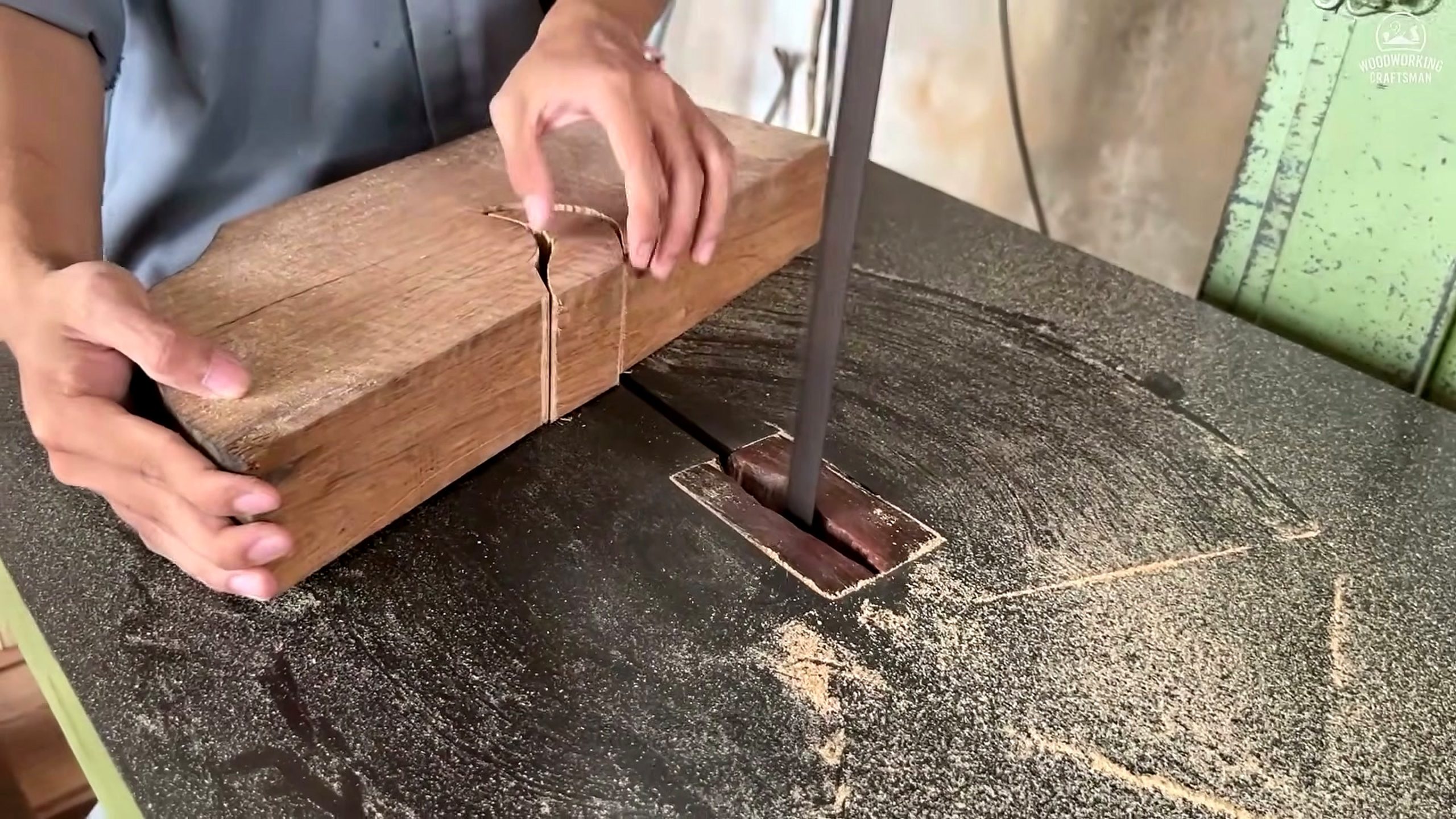 giant twisted burl lychee wood root - long component following a marked curved profile through the bandsaw