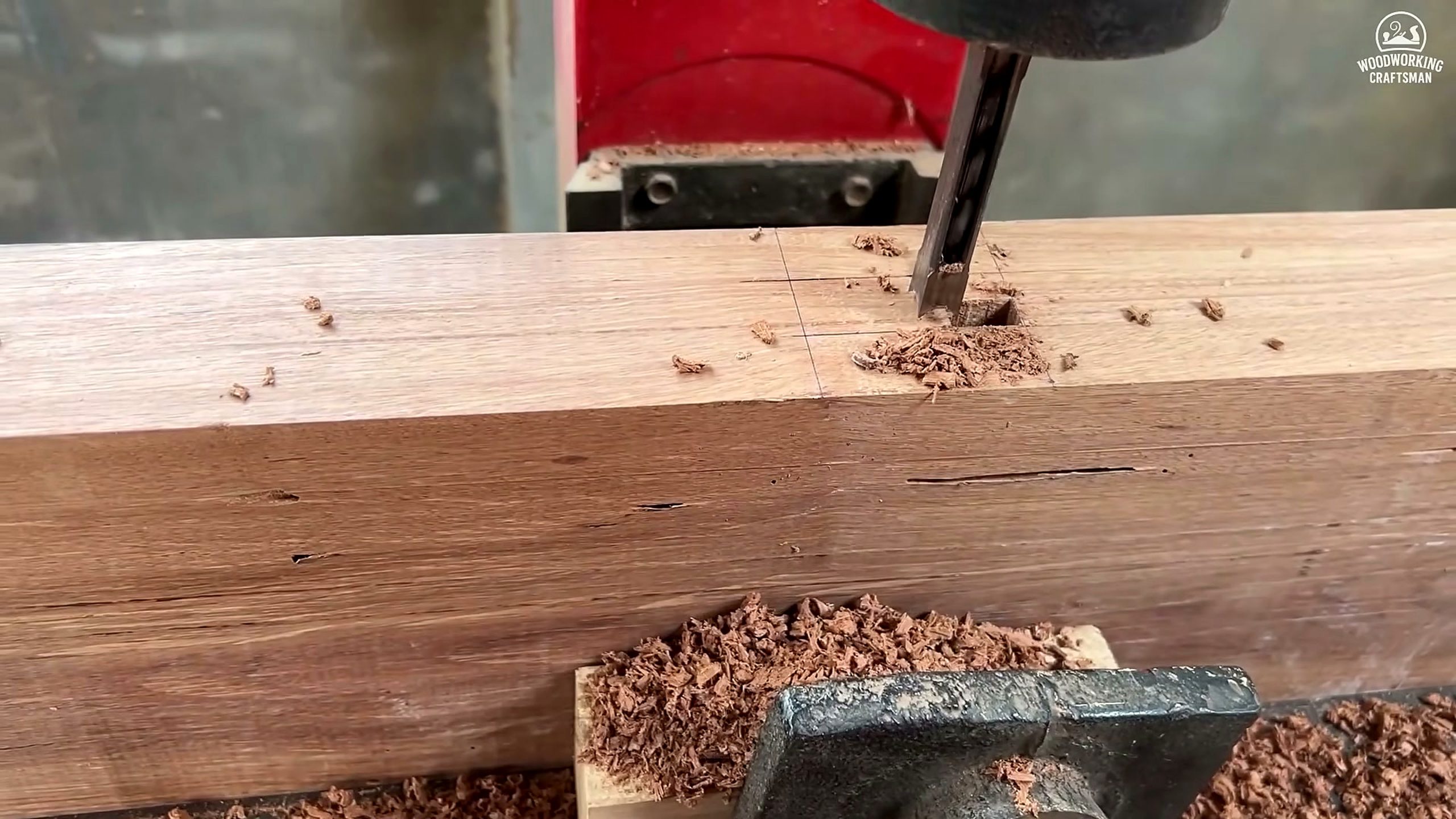 giant twisted burl lychee wood root - vertical drilling operation preparing joinery in a long timber component