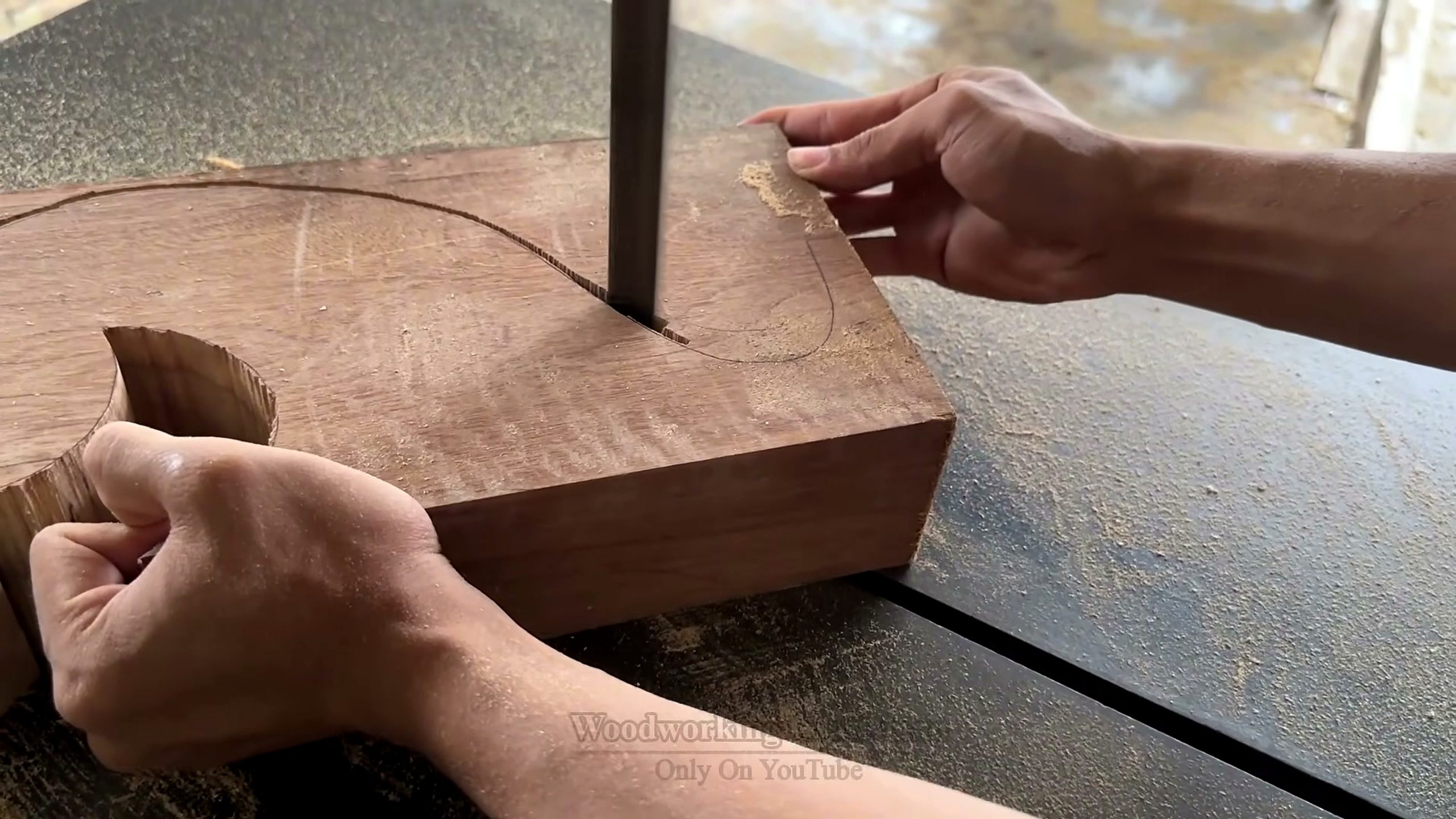 giant twisted burl lychee wood root - thick block following a curved layout line at the bandsaw