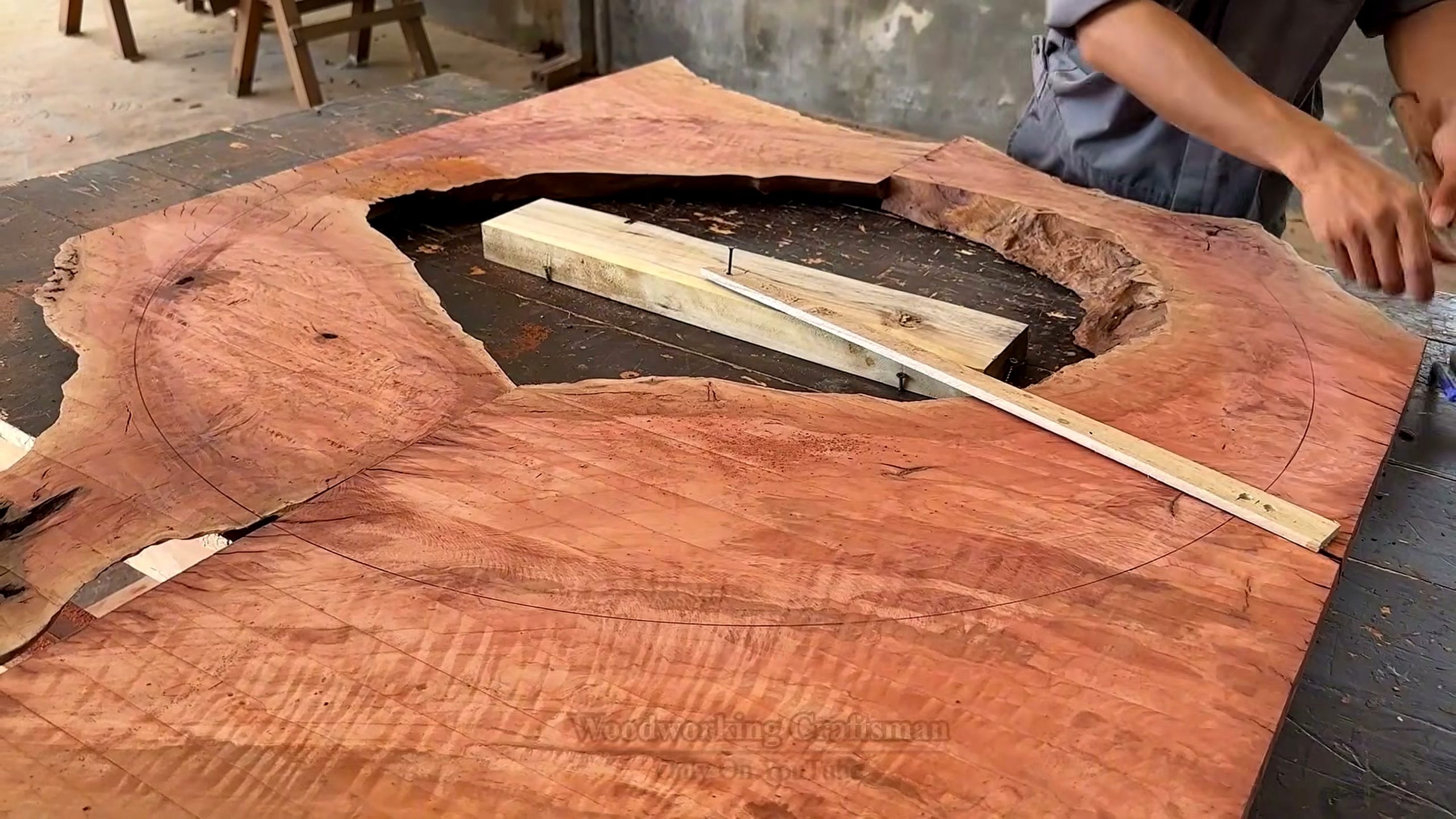 giant twisted burl lychee wood root - irregular slab mapped with straight strips and layout lines before cutting