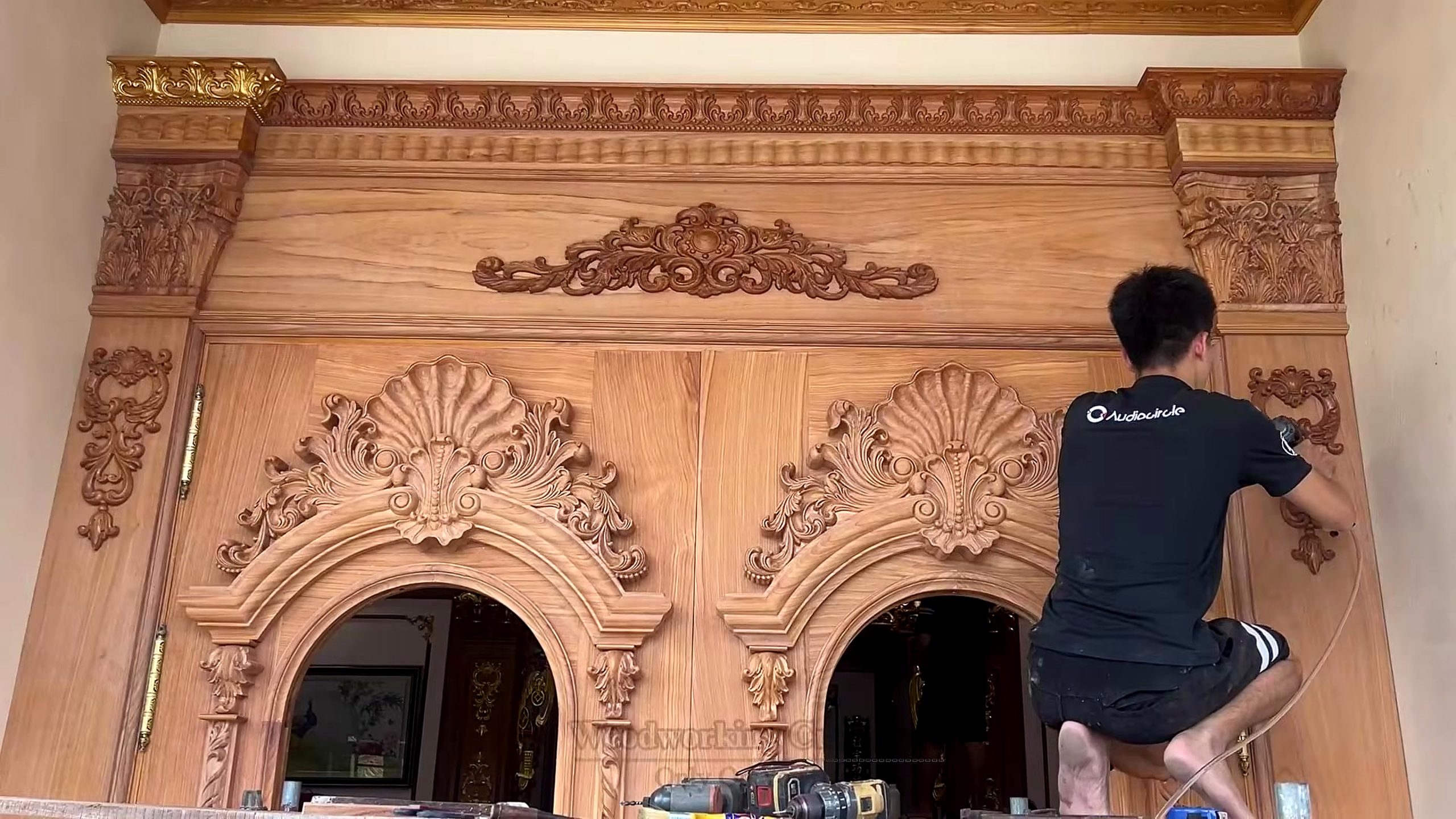 giant wooden door handcrafted installation process - the later handling or installation stage where weight, alignment, and finish protection matter