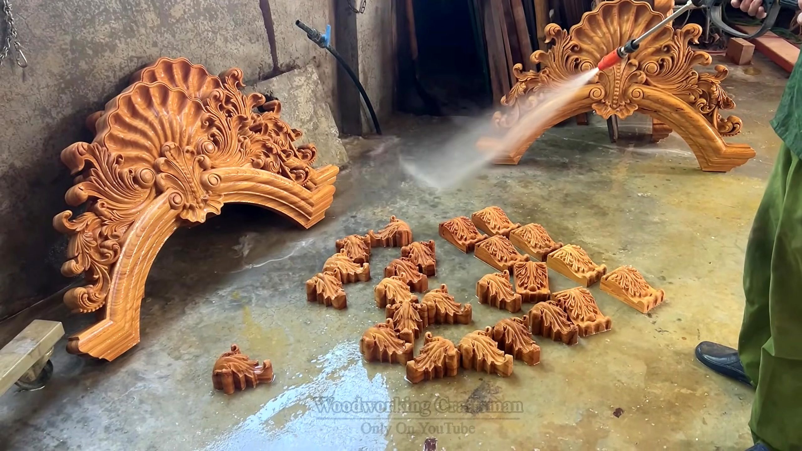 giant wooden door handcrafted installation process - hand or machine surface work used to refine the door face and details