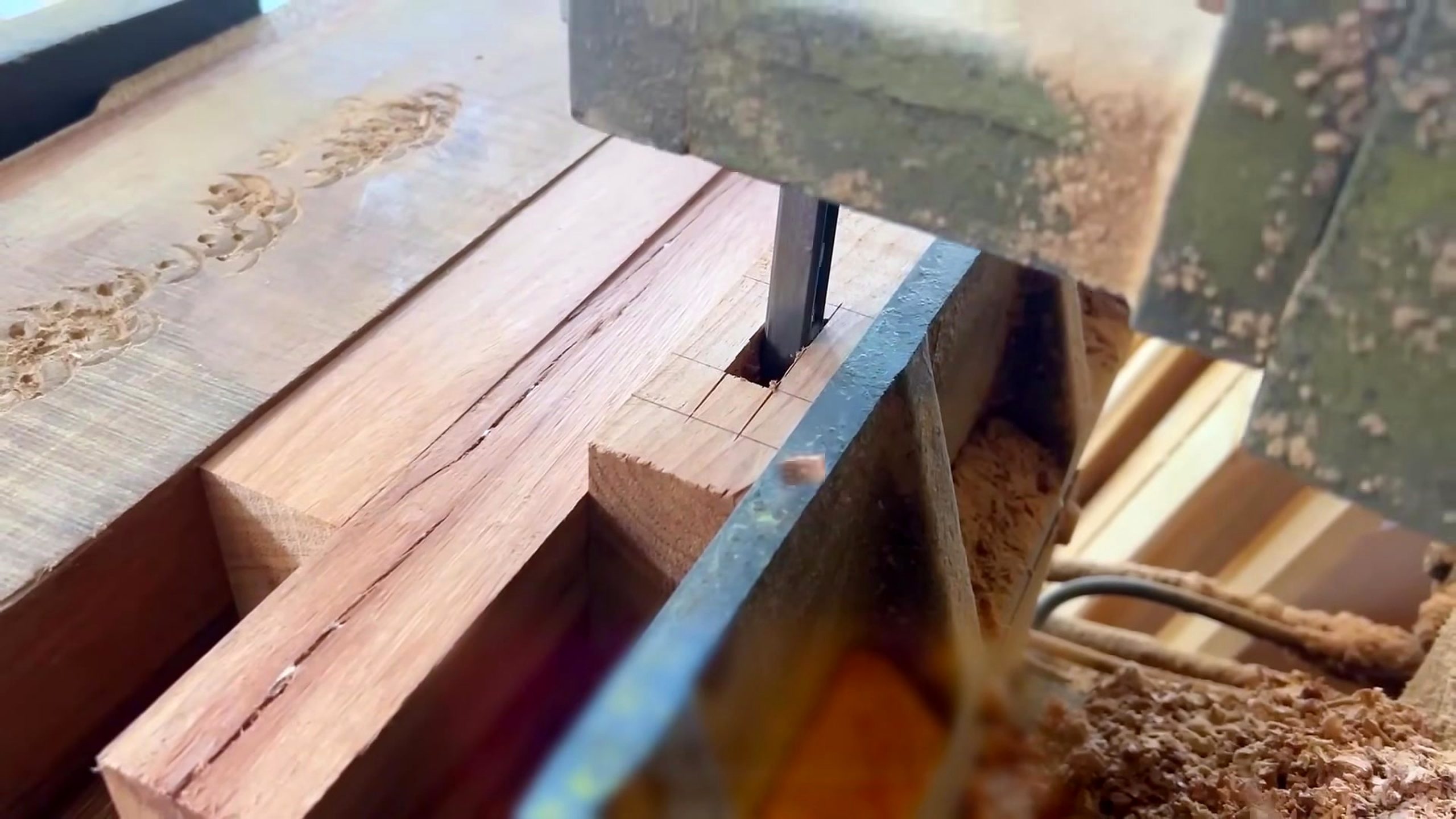 hardwood cabinet frame and panel process - a rectangular joint or notch being cut into a thick rail end on the bandsaw