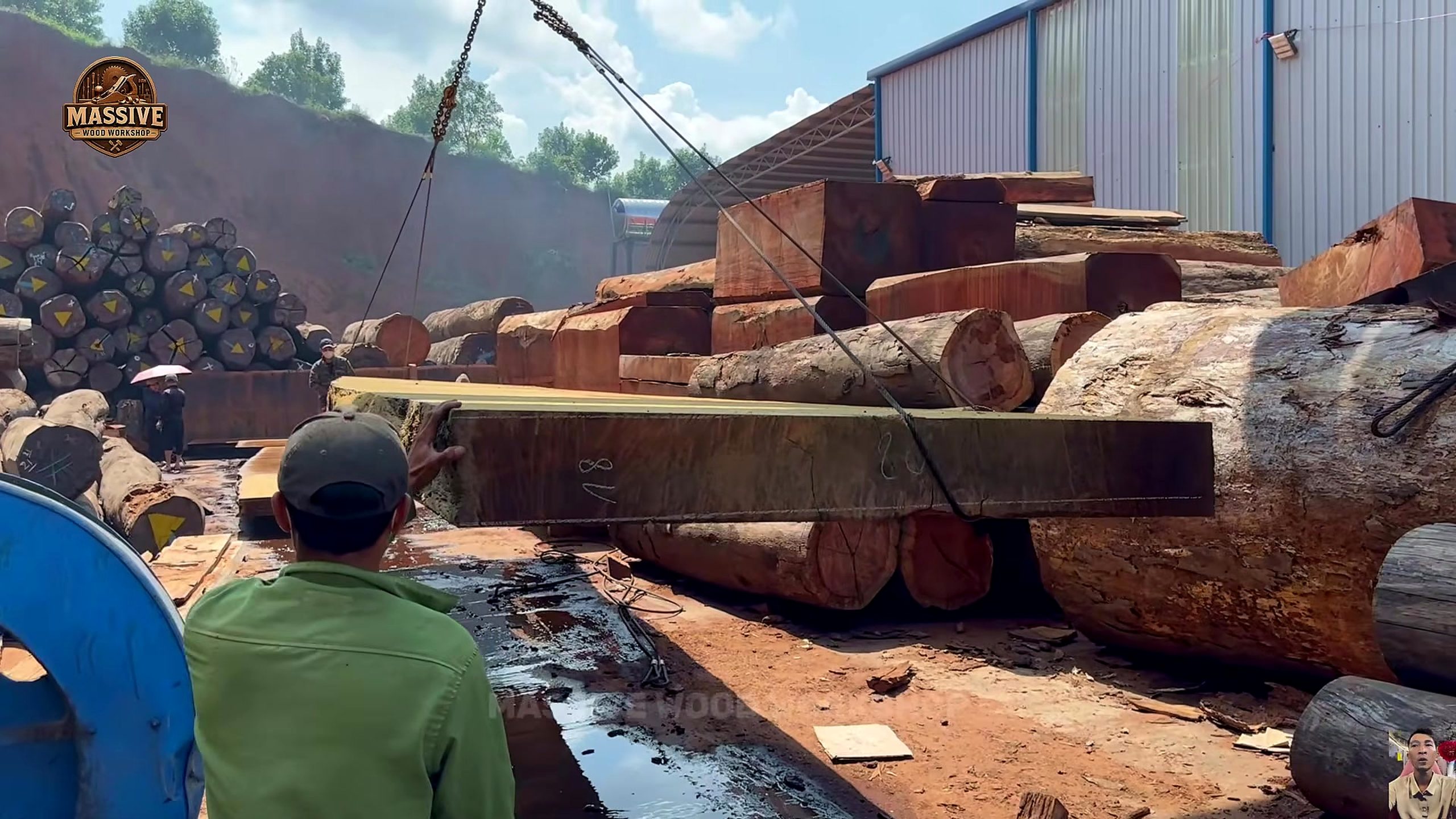 forest giant to live edge slab inspection showing the very wide slab surface being checked after the opening cut