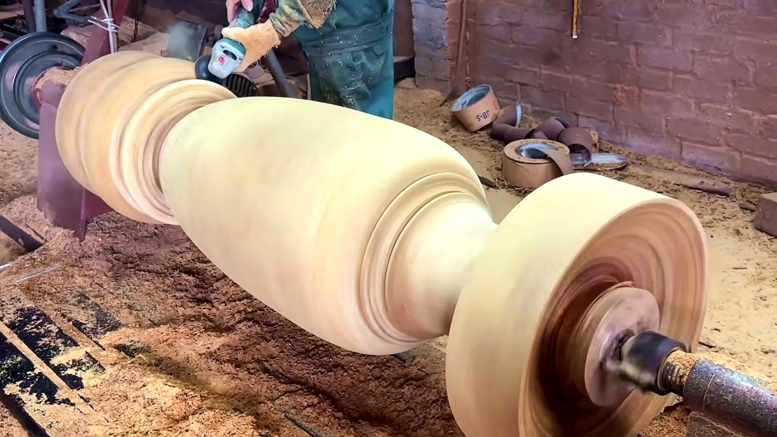 large wood log lathe turning process - the pedestal body developed with beads, coves, shoulders, and a narrow waist