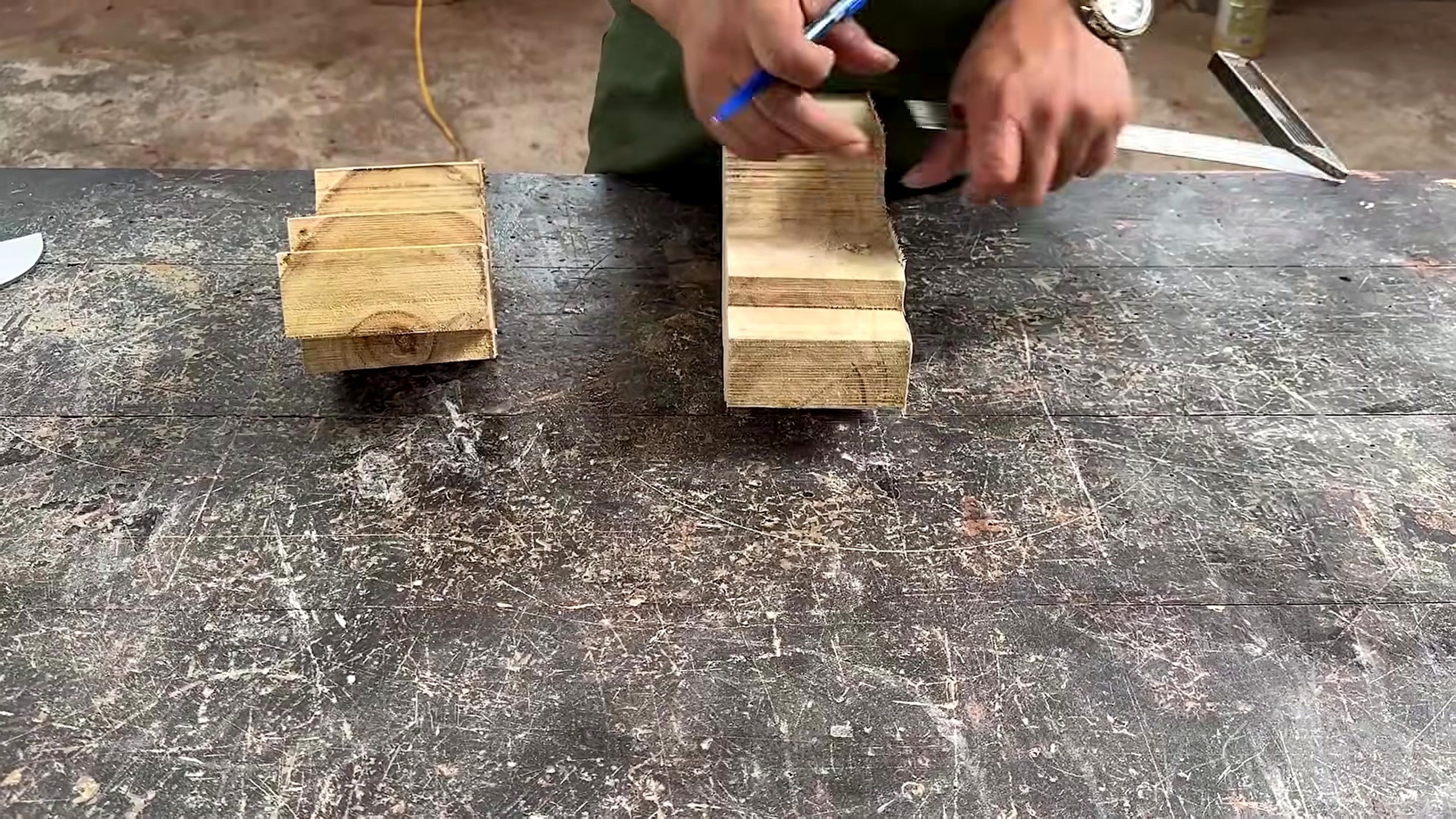 old wood furniture carpentry project - small blocks marked on the bench before the next fitting step