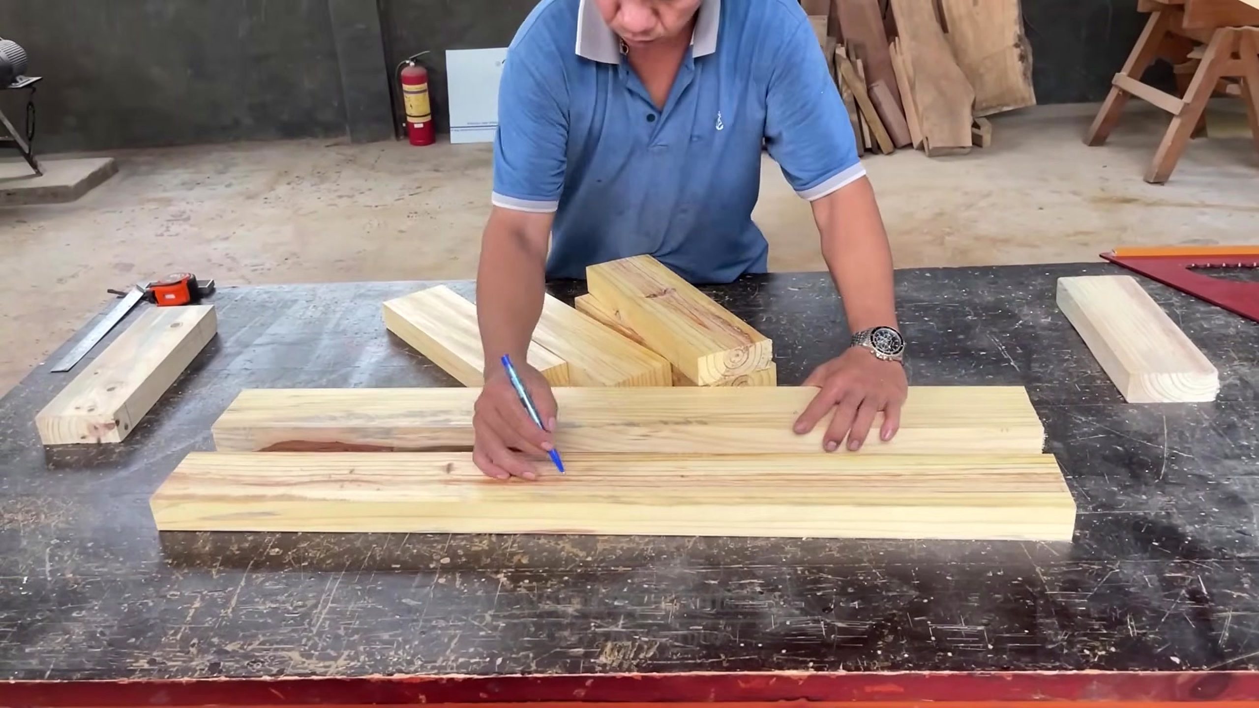 lychee red log dining table process - marking long boards before tabletop layout