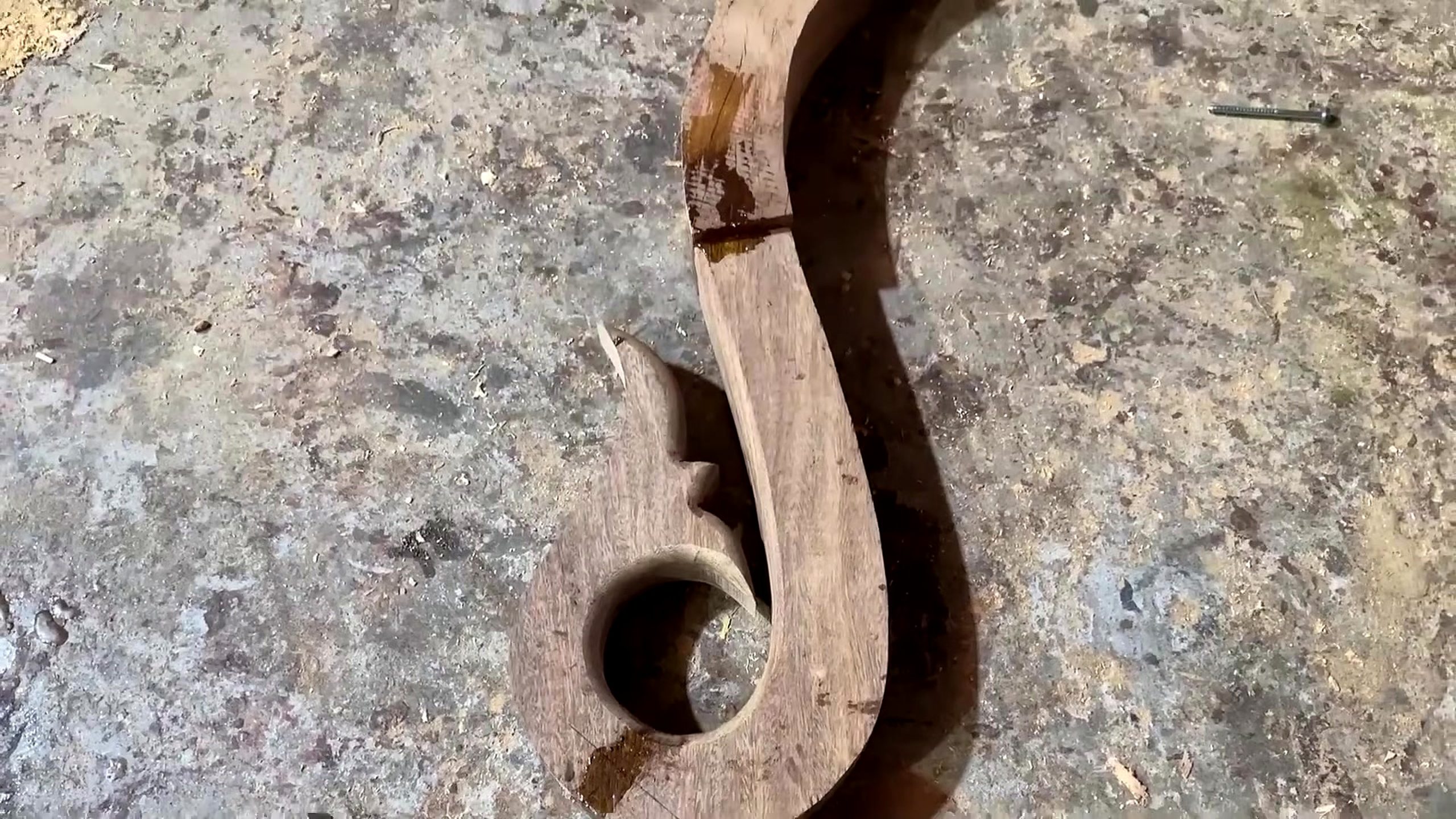 skilled woodworker crafts wooden stair railing - the later review stage where the result can be evaluated
