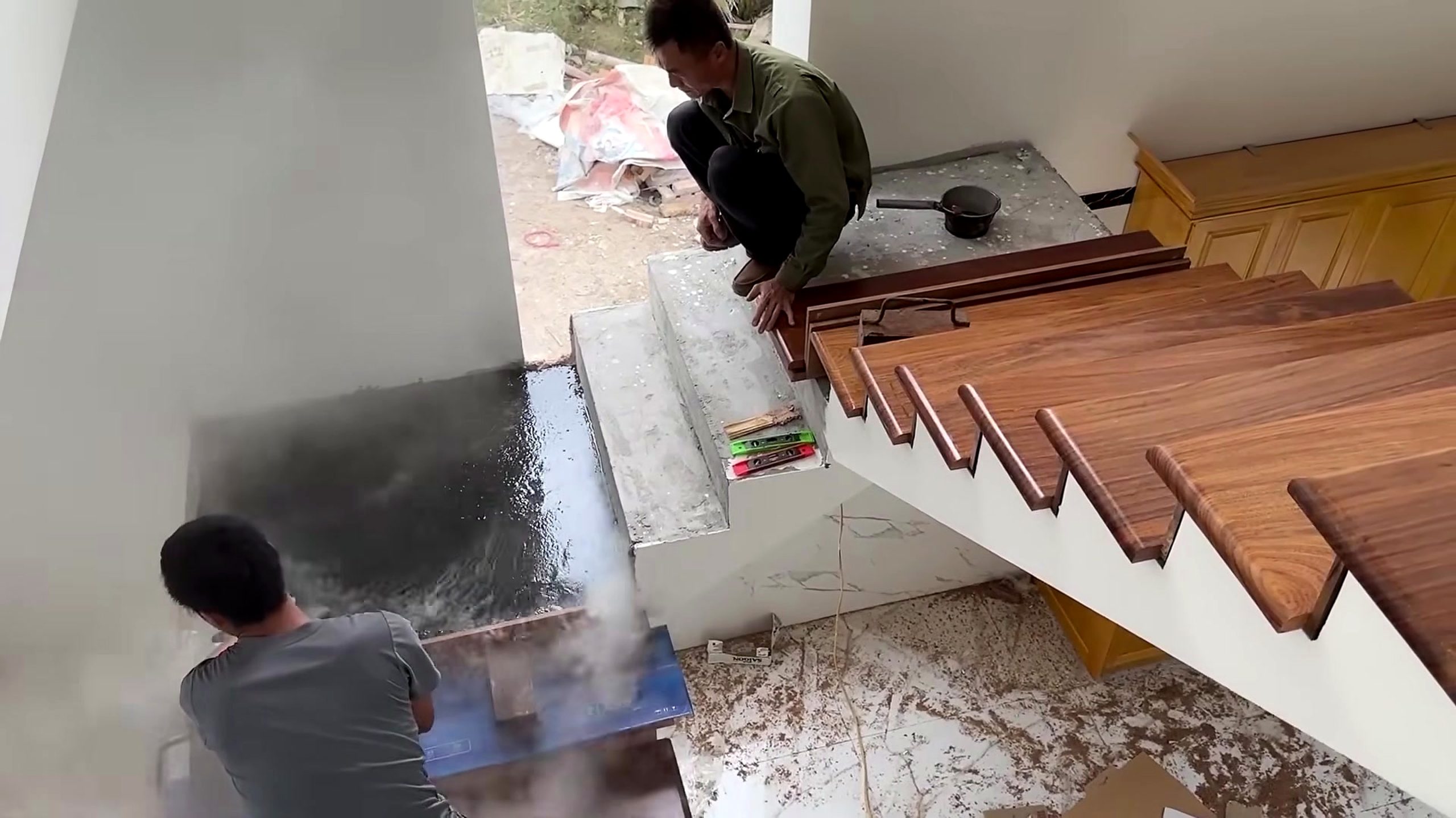 skilled woodworker crafts wooden stair railing - the setup or early workflow visible in the source video