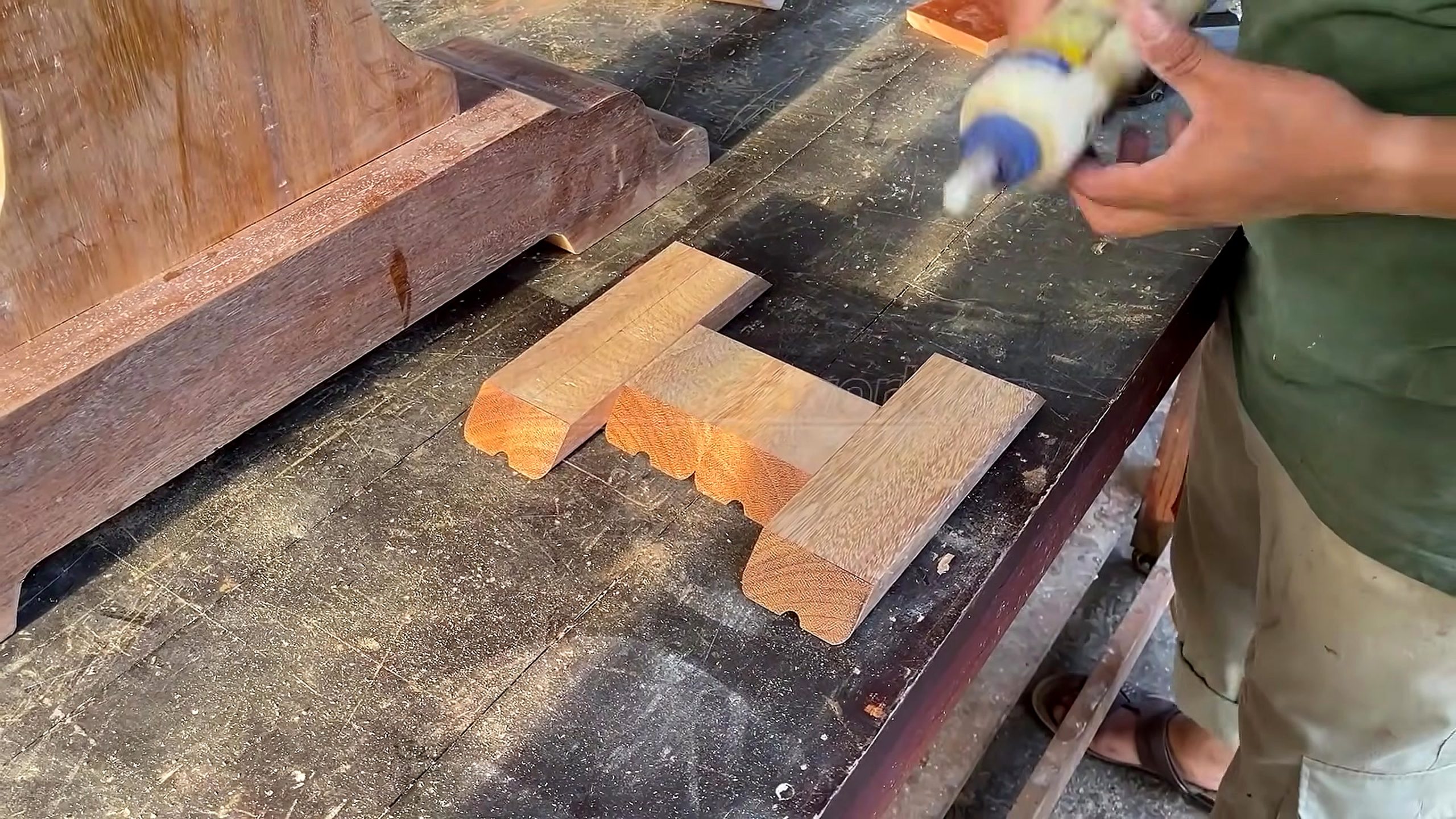 solid wood furniture frame joinery process - shaped feet and a long rail arranged with glue before frame assembly