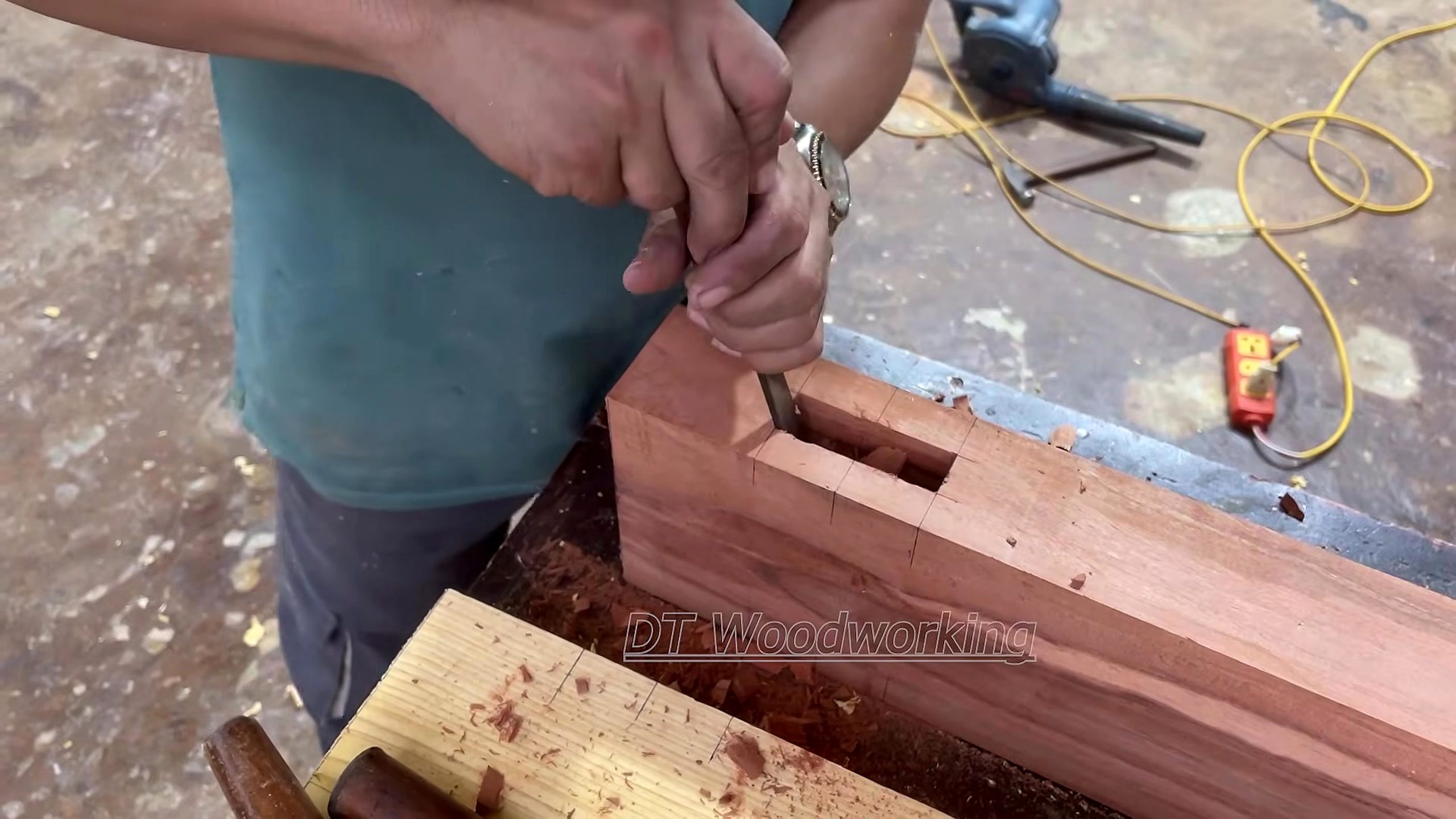 solid wood furniture frame joinery process - a long solid-wood rail being measured at a rectangular mortise or recess