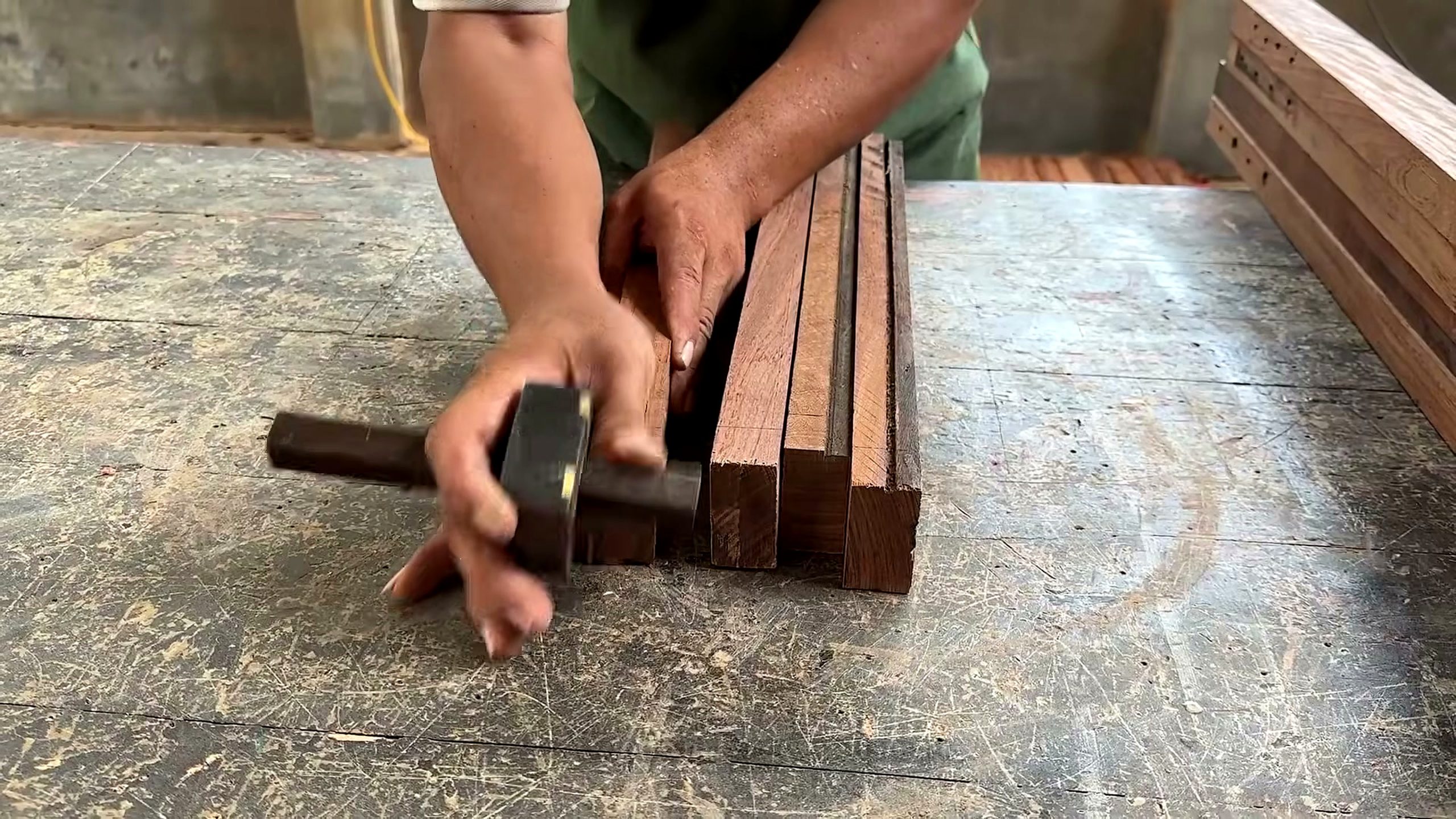 using centuries old decayed warped wood - narrow reclaimed rails being trued on the bench before final shell assembly