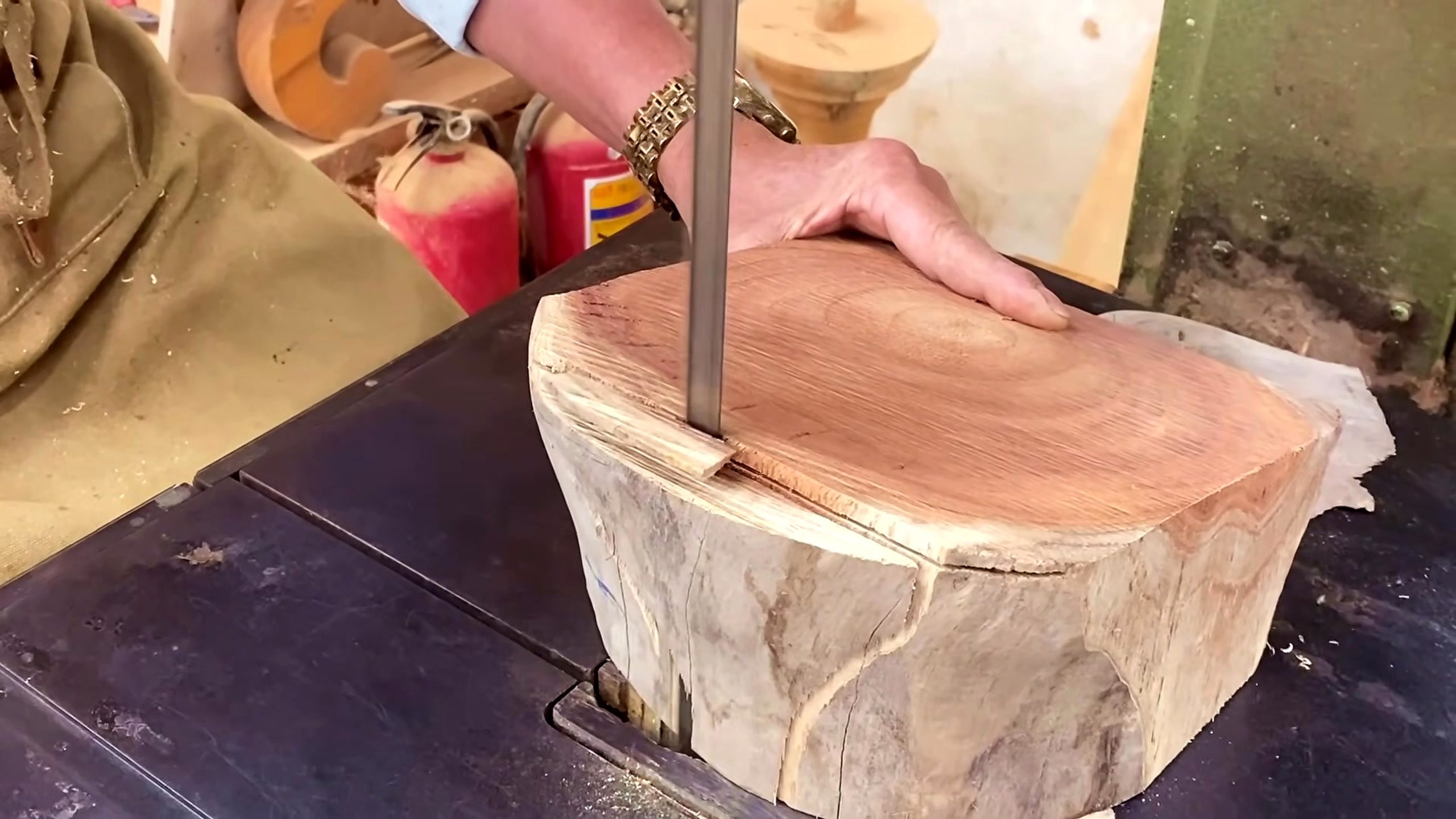 wooden tool lathe turning process - a wooden block being relieved at a vertical bandsaw before turning