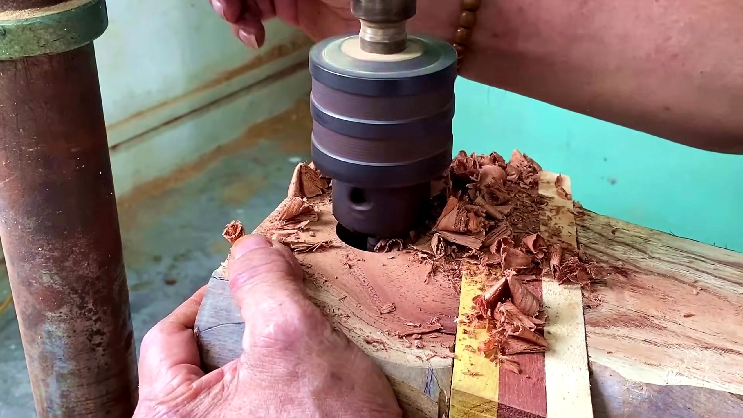 wooden tool lathe turning process - a drill or boring operation preparing the blank for later mounting
