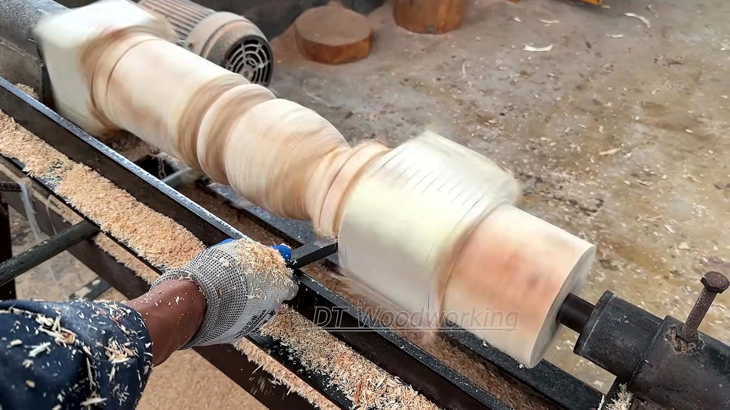 geometric marquetry furniture making process - a long furniture spindle being shaped with repeated beads and coves