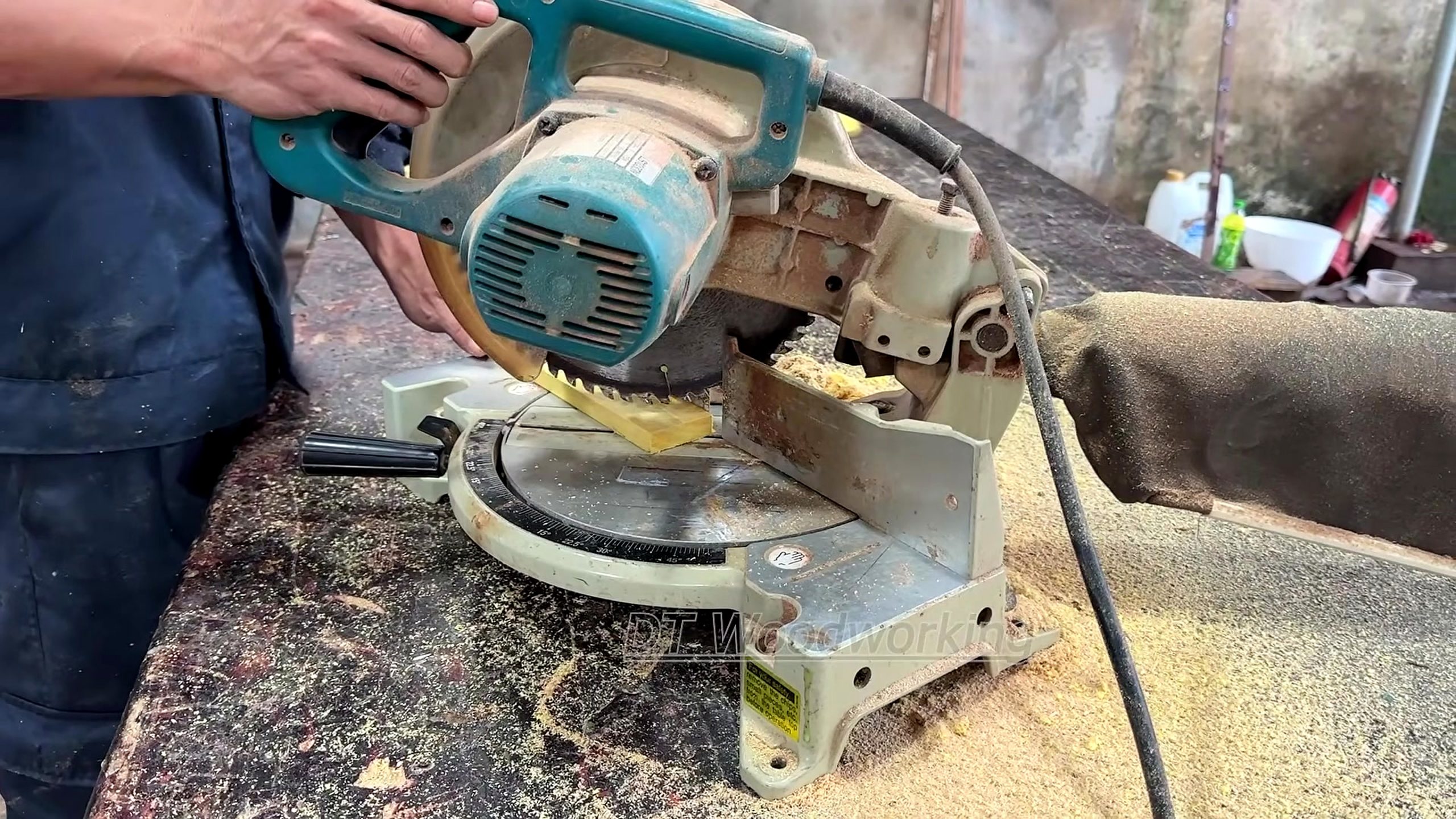 geometric marquetry furniture making process - solid stock being crosscut to working length on the miter saw