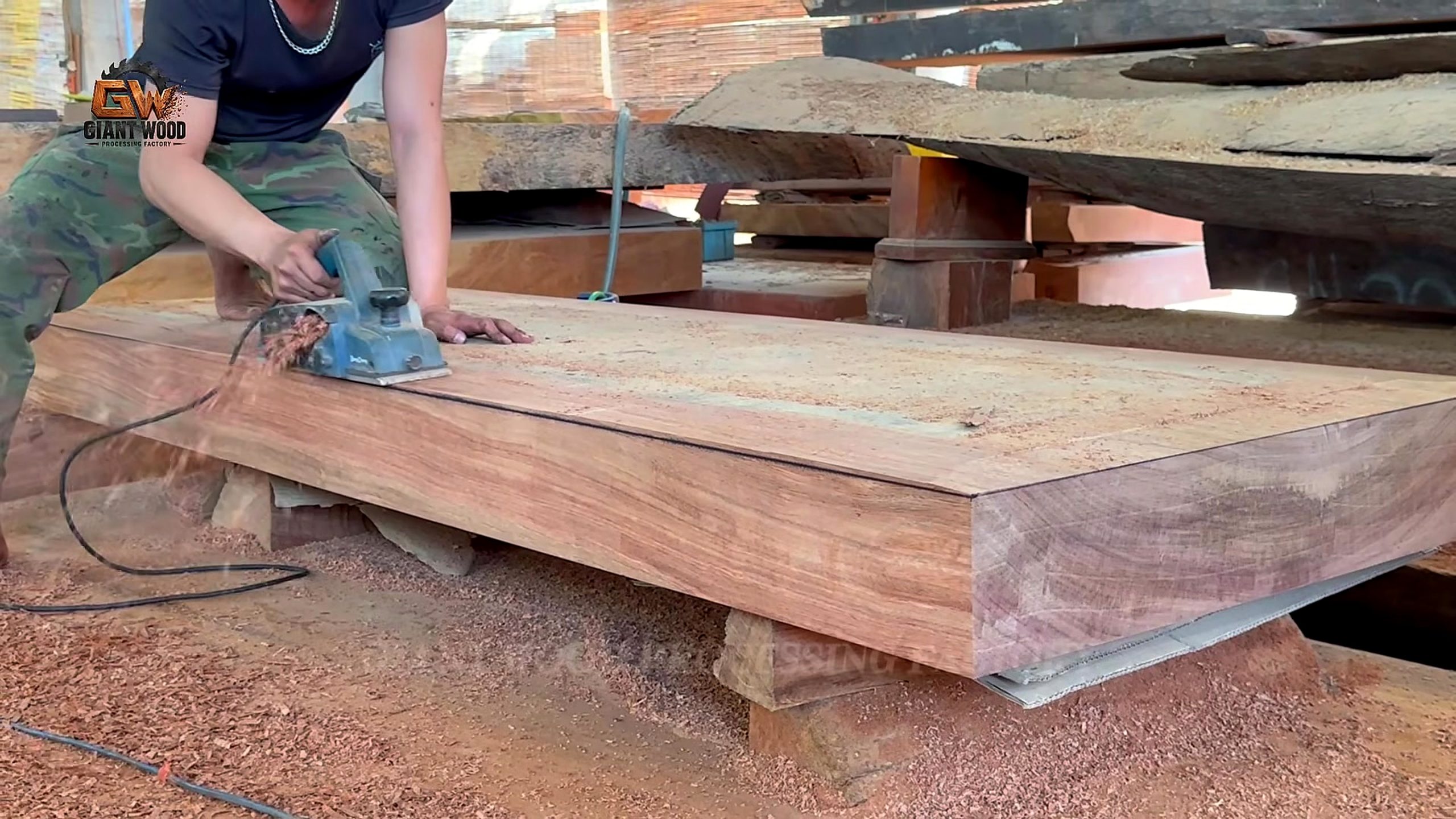 giant fallen tree bandsaw slab recovery - crane sling handling a long squared timber at 5325.91 seconds