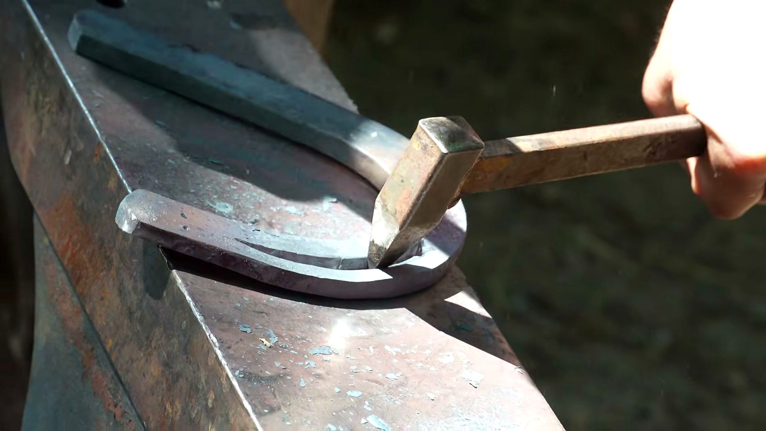 how farrier forges horseshoe for giant - the main work stage that carries the video's practical lesson